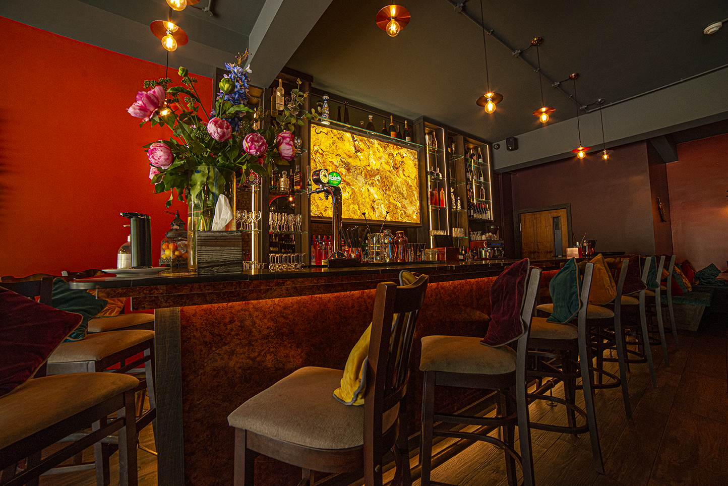Stylish bar venue with vibrant decor for intimate gatherings and networking events.