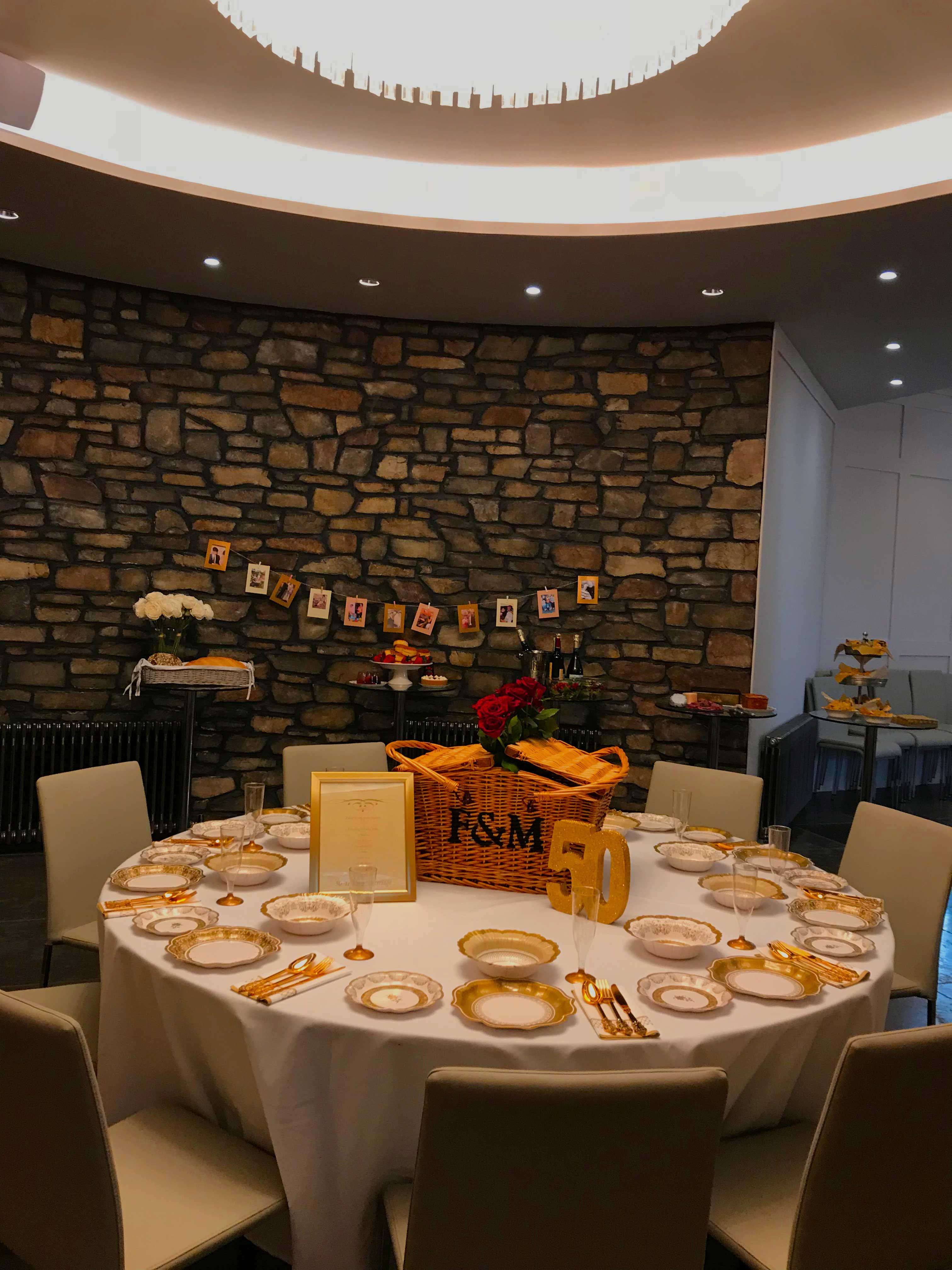 Elegant round table with flower centerpiece at Clifton Observatory for milestone celebrations.