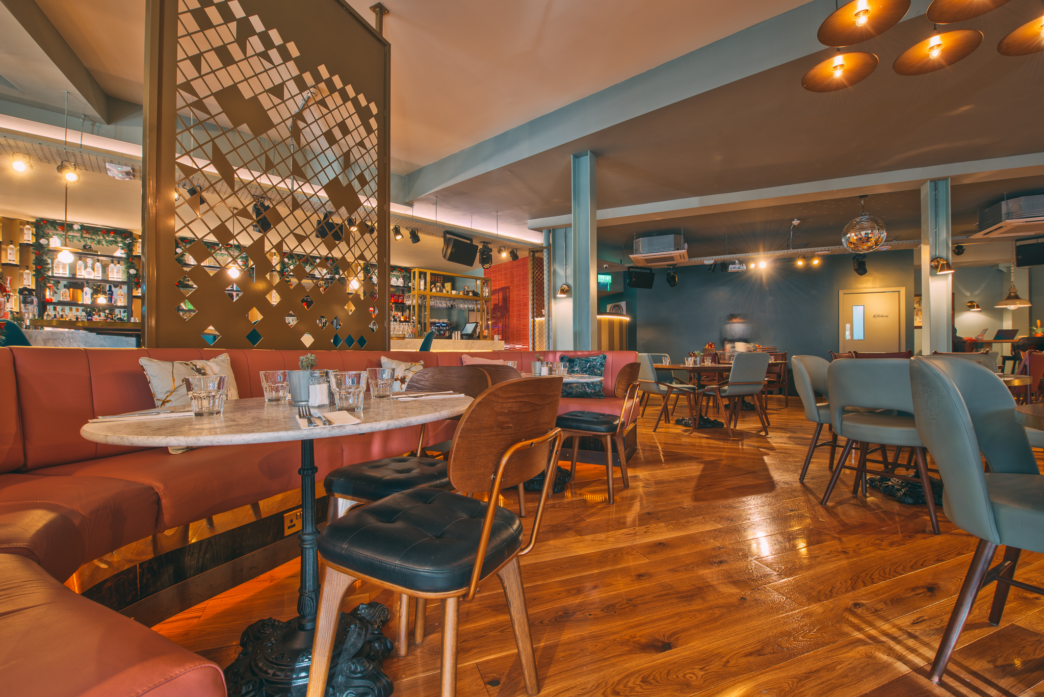 Modern event venue with warm wood floors in Revolution Solihull, perfect for gatherings.