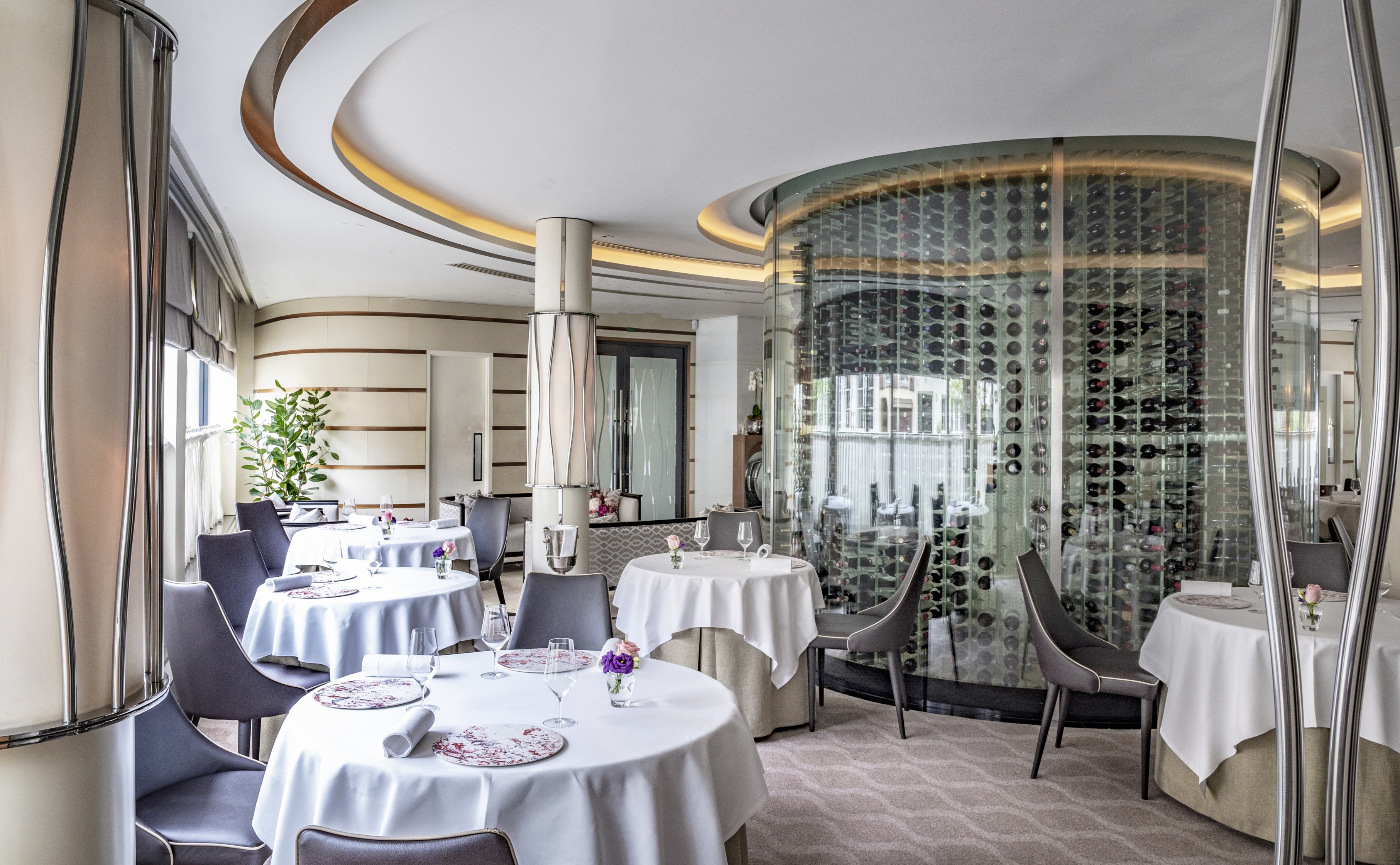 Elegant dining space at Petrus for exclusive events with luxurious wine display.