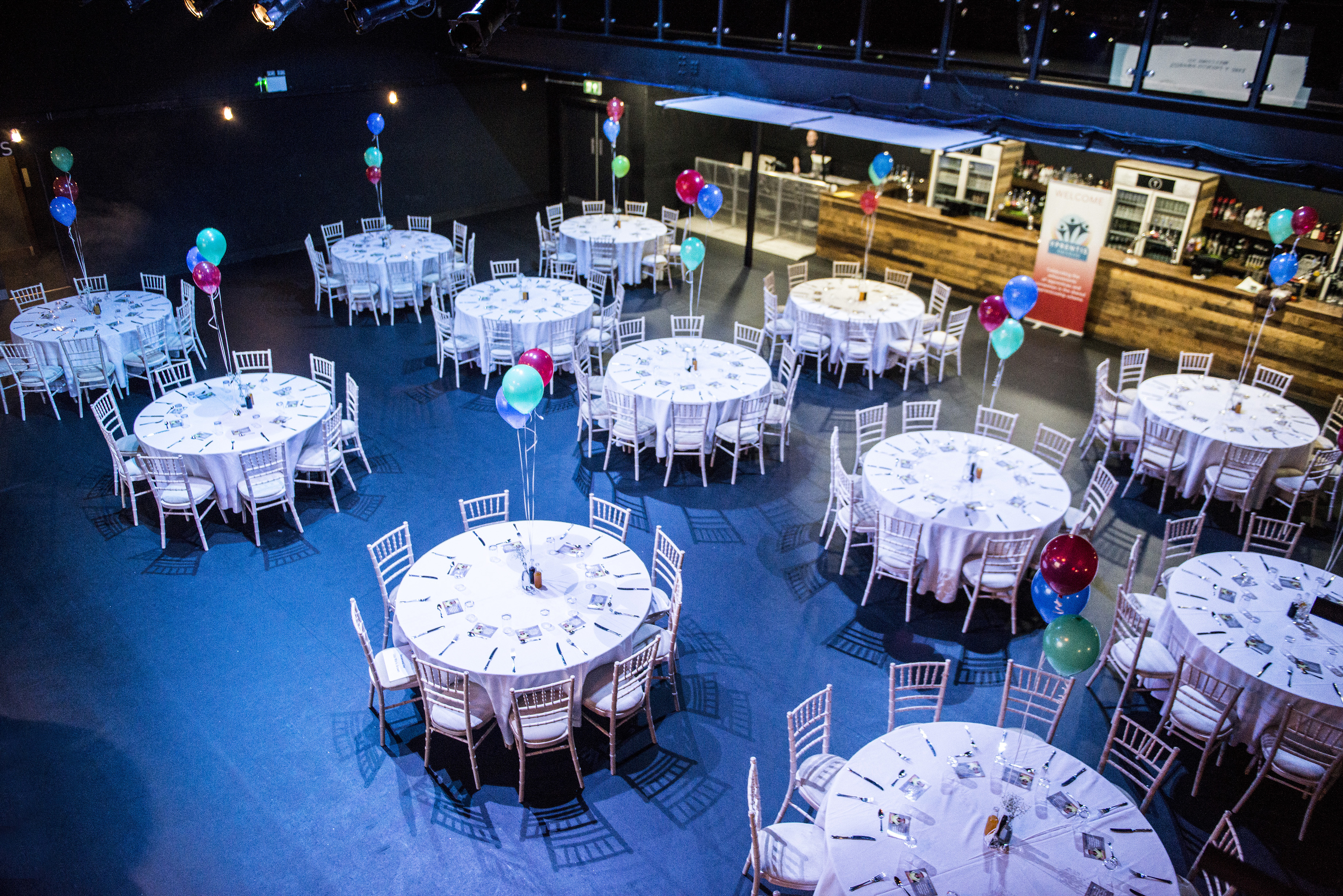 Main Room in Tramshed Cardiff with elegant round tables for networking events.