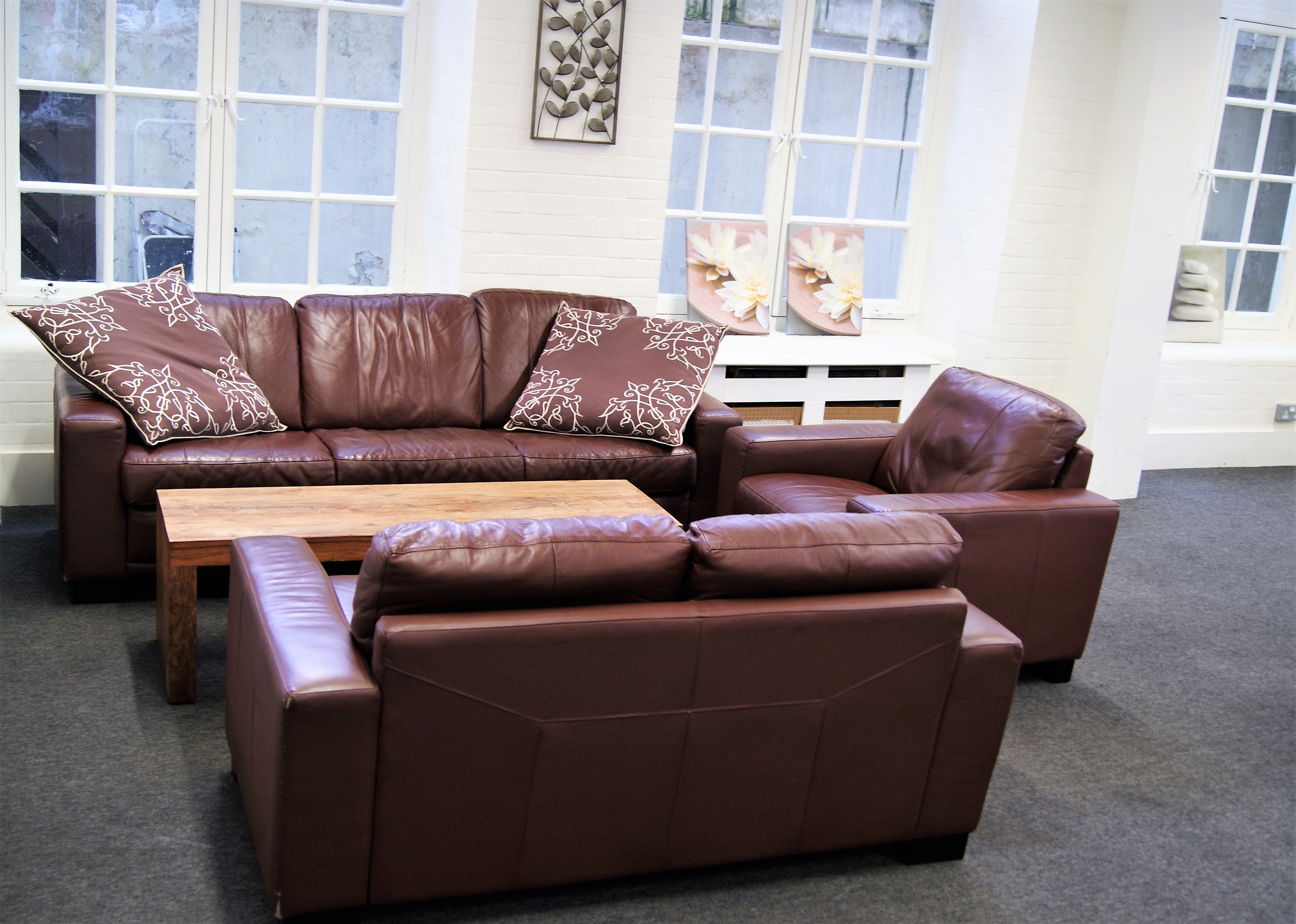 Cozy Portman Lounge in SPACE, Marylebone with brown leather sofas for networking events.