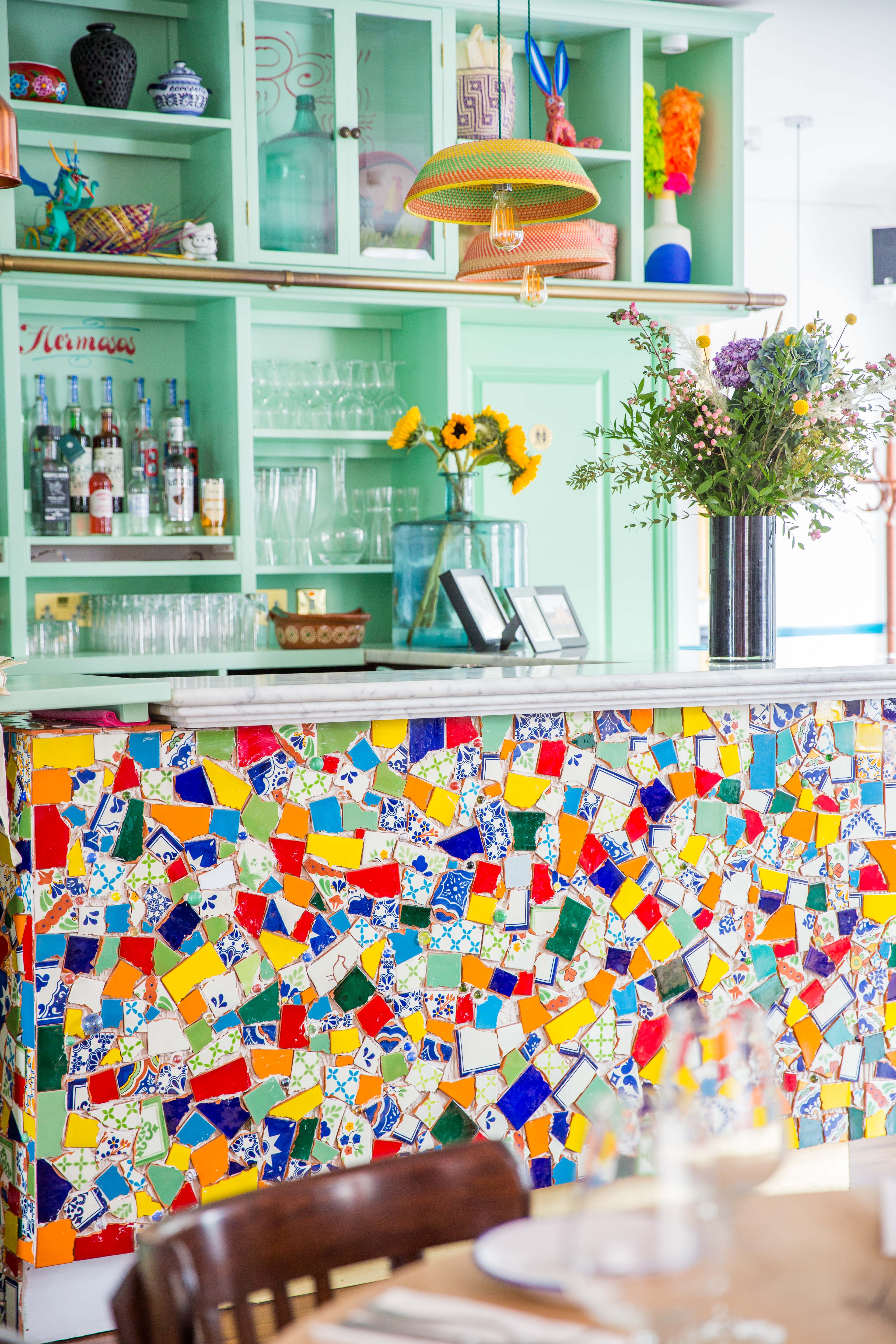 Tequila & Mezcal Bar with colorful mosaic countertop, perfect for lively events.