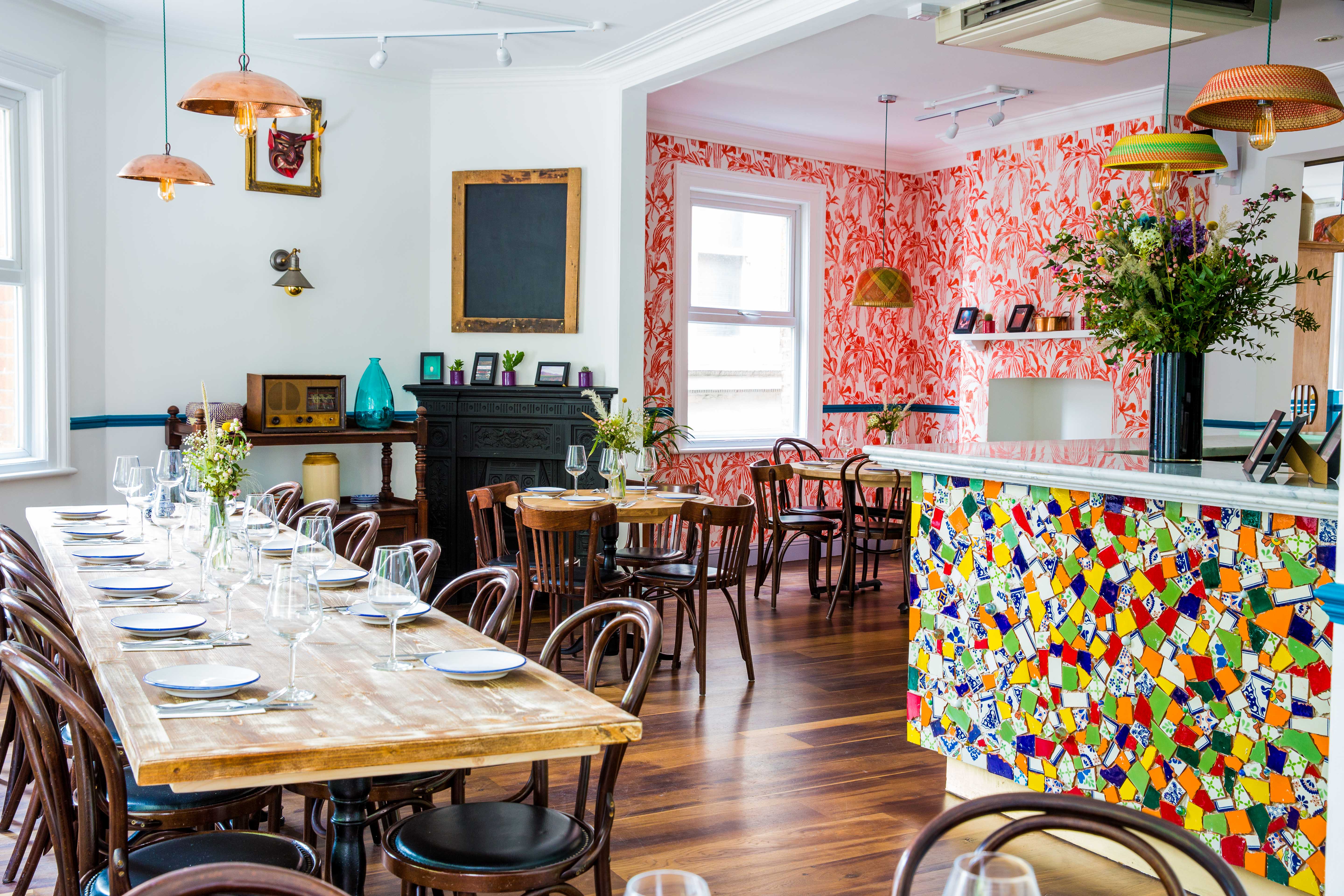 Tequila & Mezcal Bar dining table set for intimate gatherings in vibrant decor.