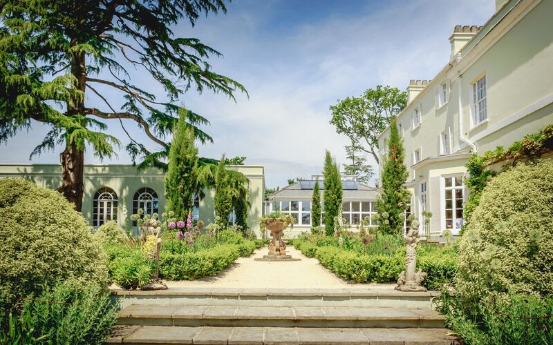 Deer Park Country House gardens, manicured venue for weddings and outdoor events.