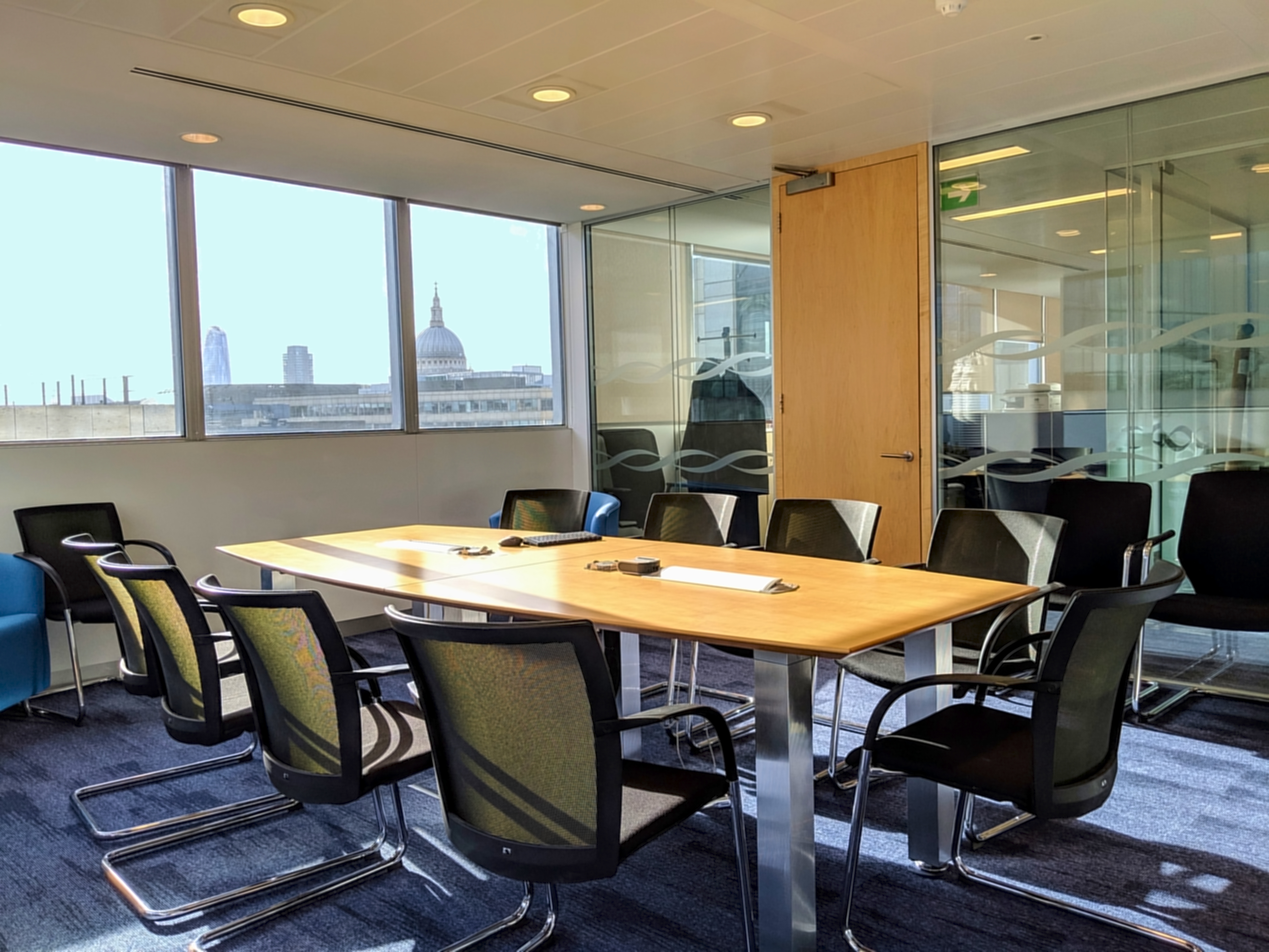 Modern 10th Floor Board Room with skyline views, ideal for corporate meetings and presentations.
