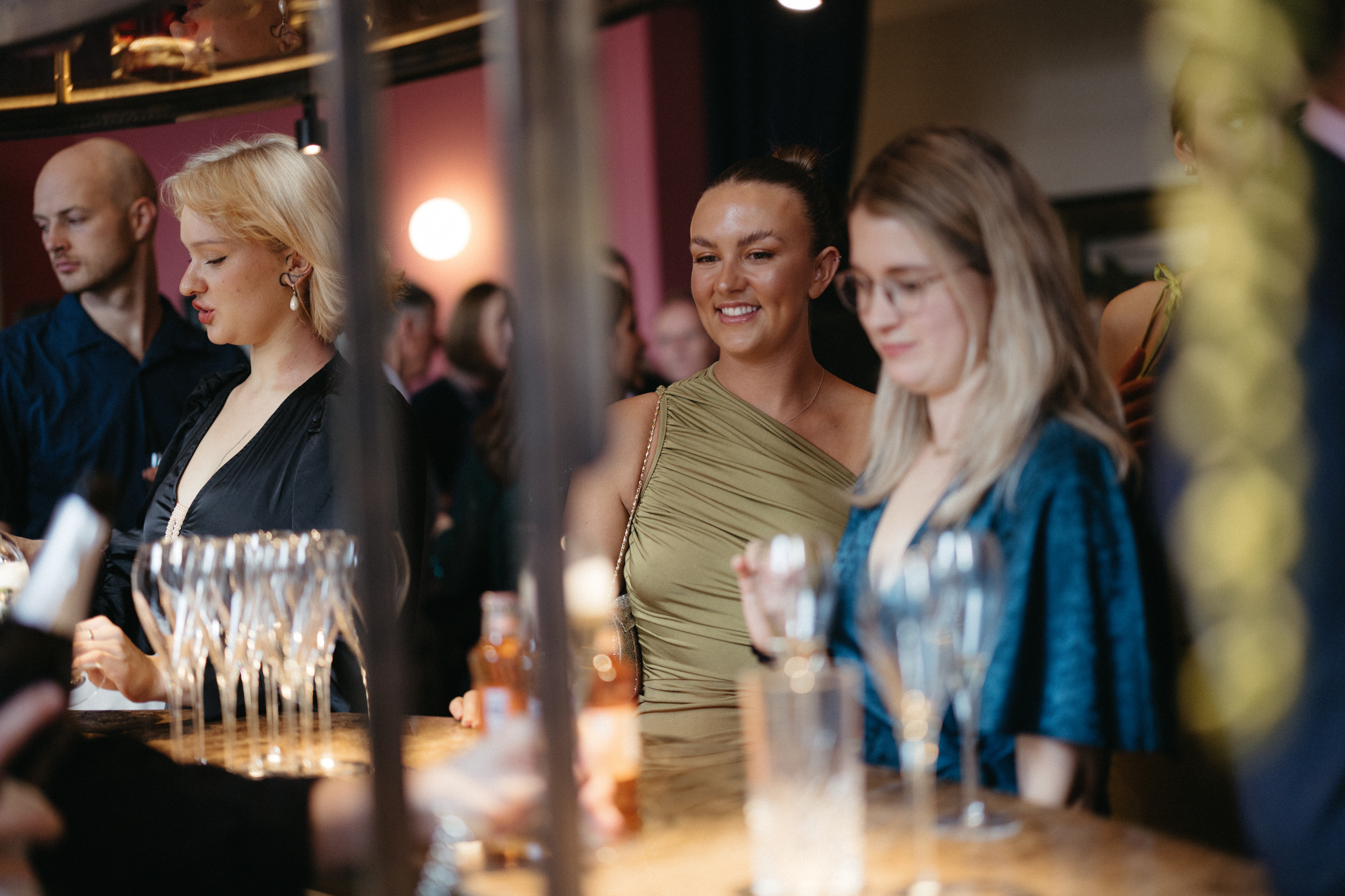 Vibrant social gathering at The Salon in Kindred, stylish bar for networking events.