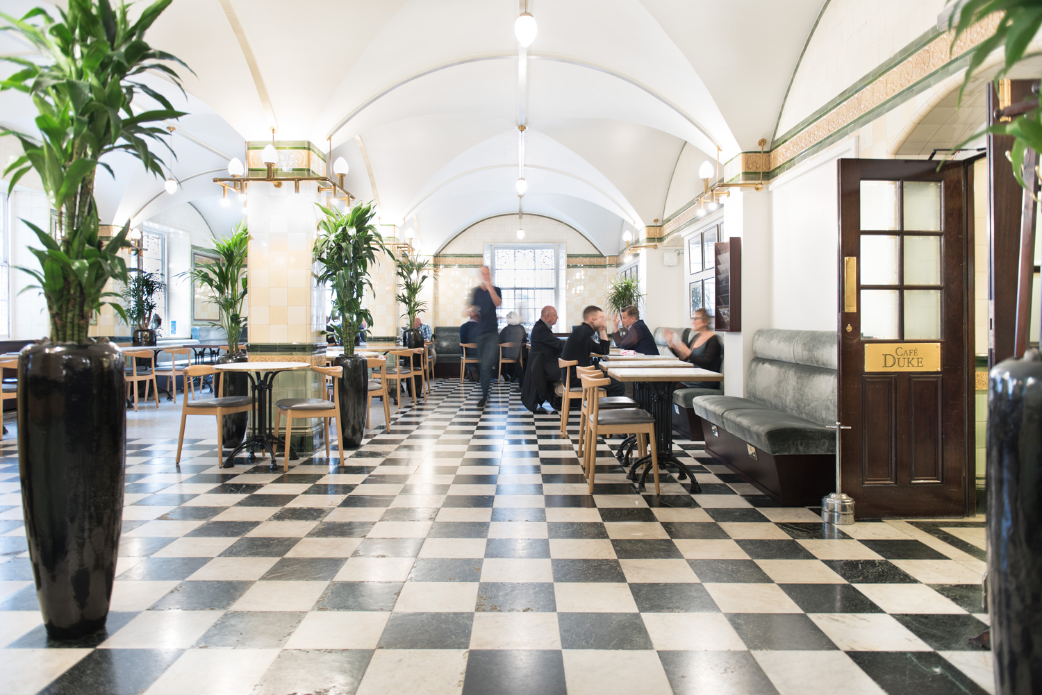 Café Duke at 116 Pall Mall: spacious venue with checkered floor for networking events.