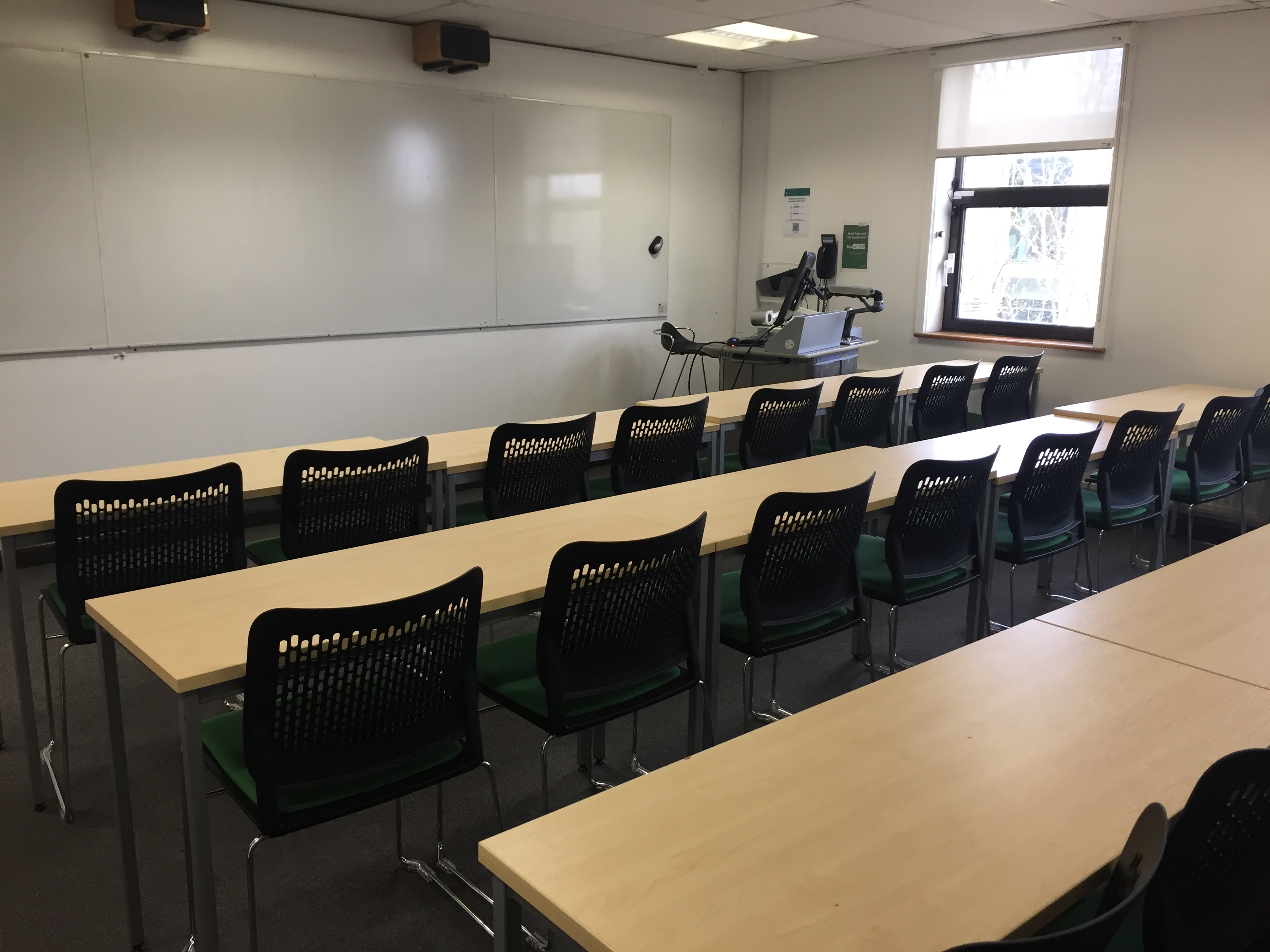 Small classroom setup with tables, ideal for workshops and training sessions in Cambridge.