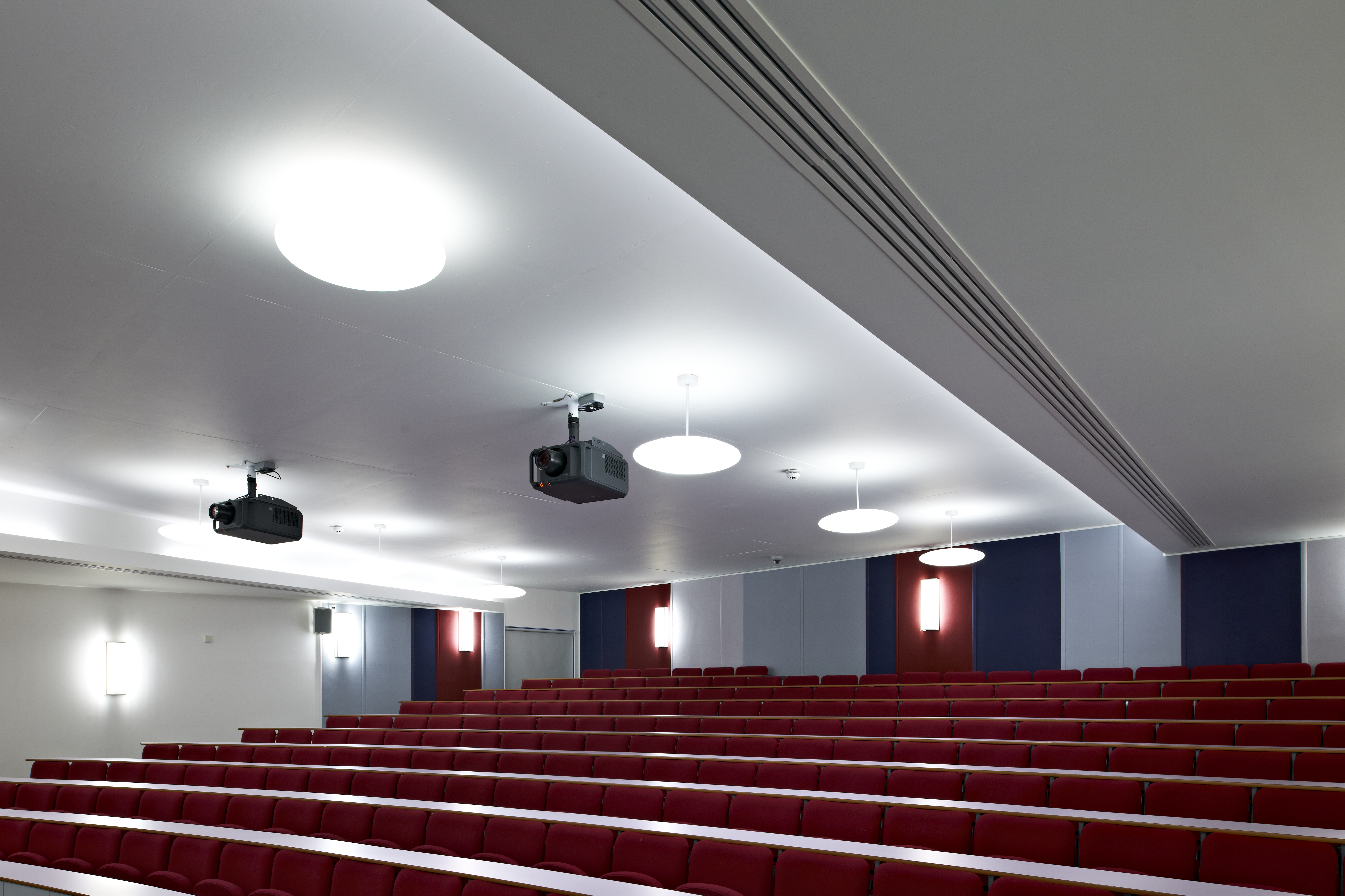Modern auditorium with tiered seating for meetings and events in Cambridge.