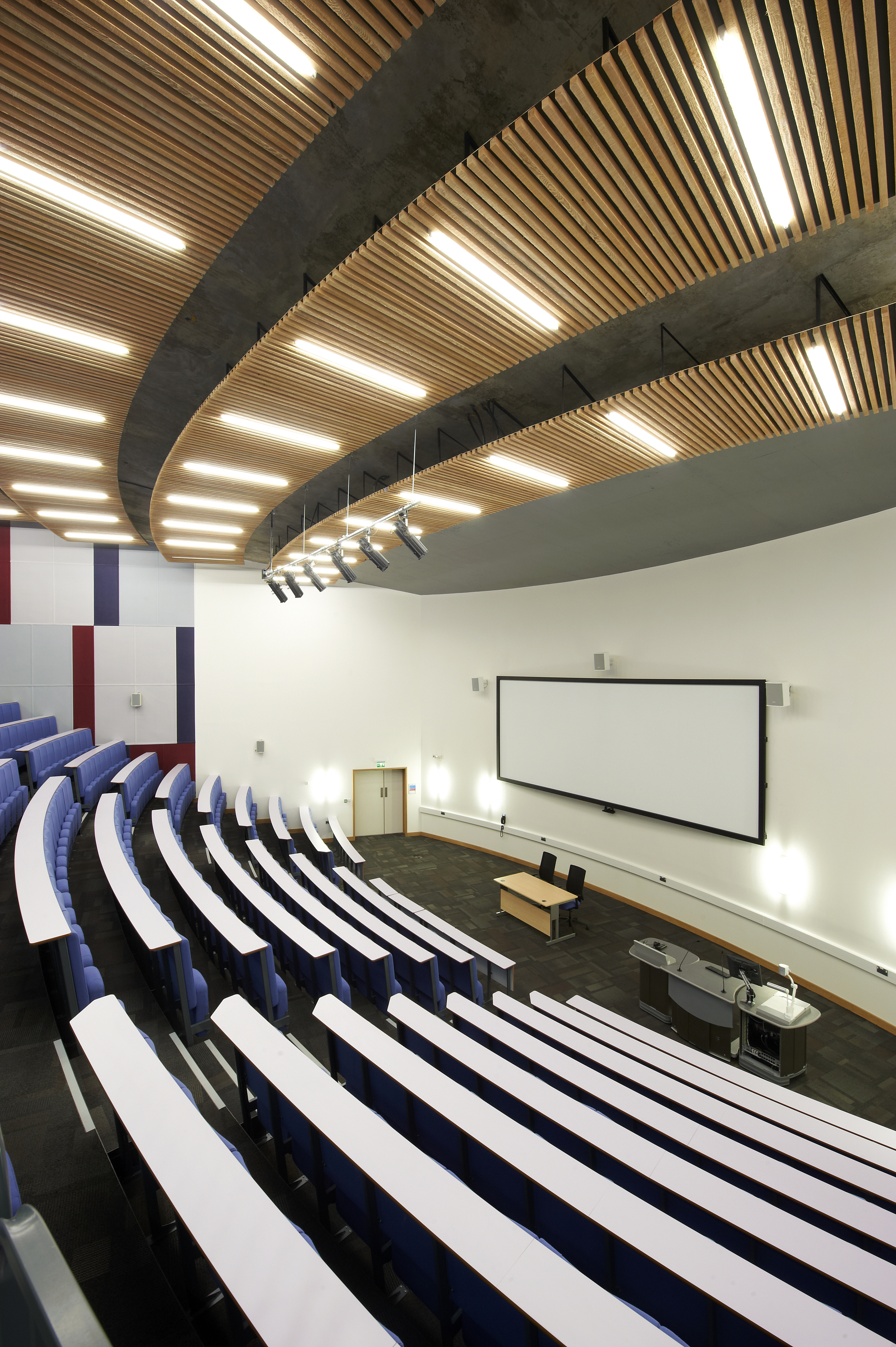 Modern auditorium with tiered seating for conferences and workshops at ARU Venue Hire.