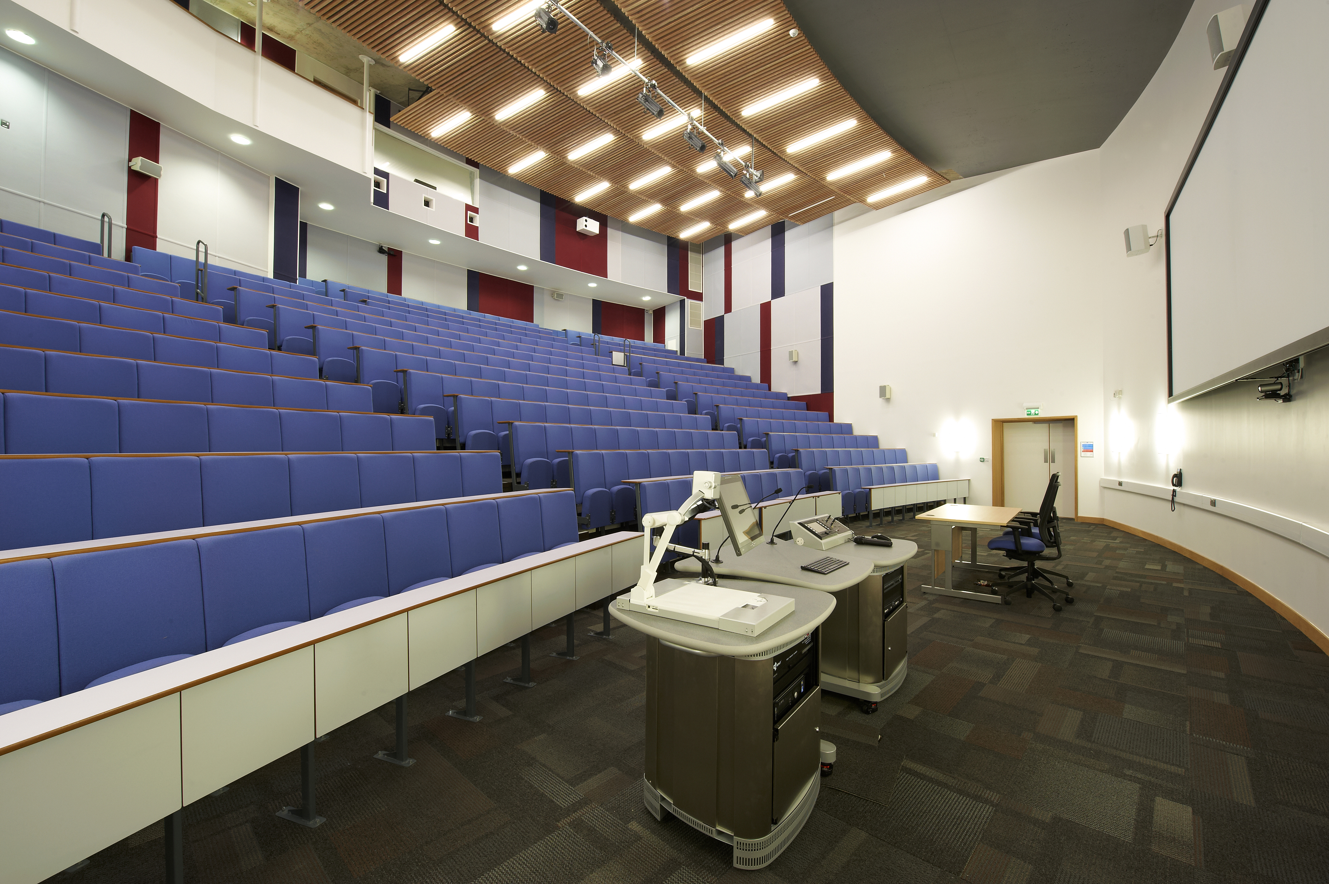 Modern lecture hall with tiered seating for conferences and educational events in Cambridge.