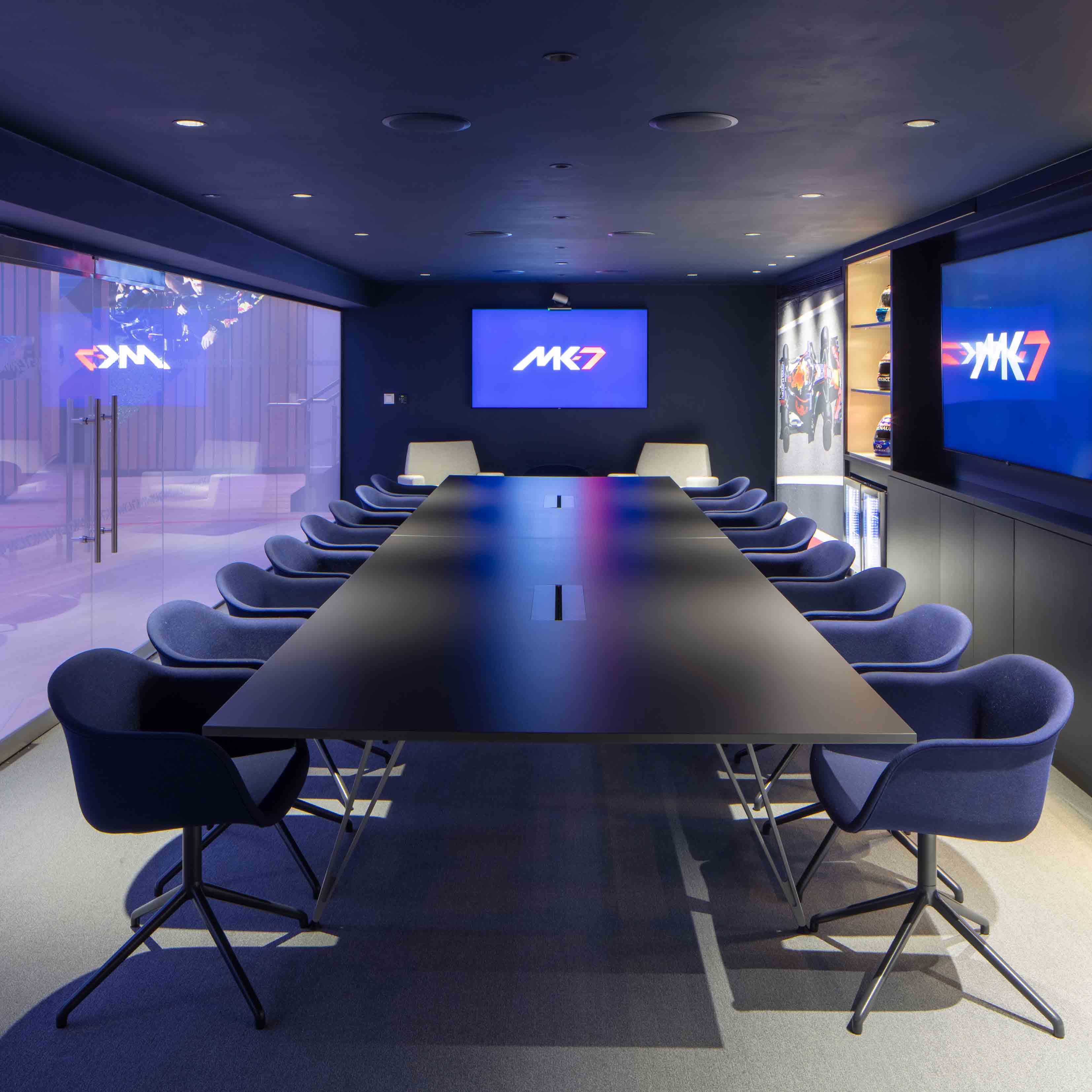 MK-7 Boardroom at Red Bull Racing: sleek conference room with modern decor for meetings.