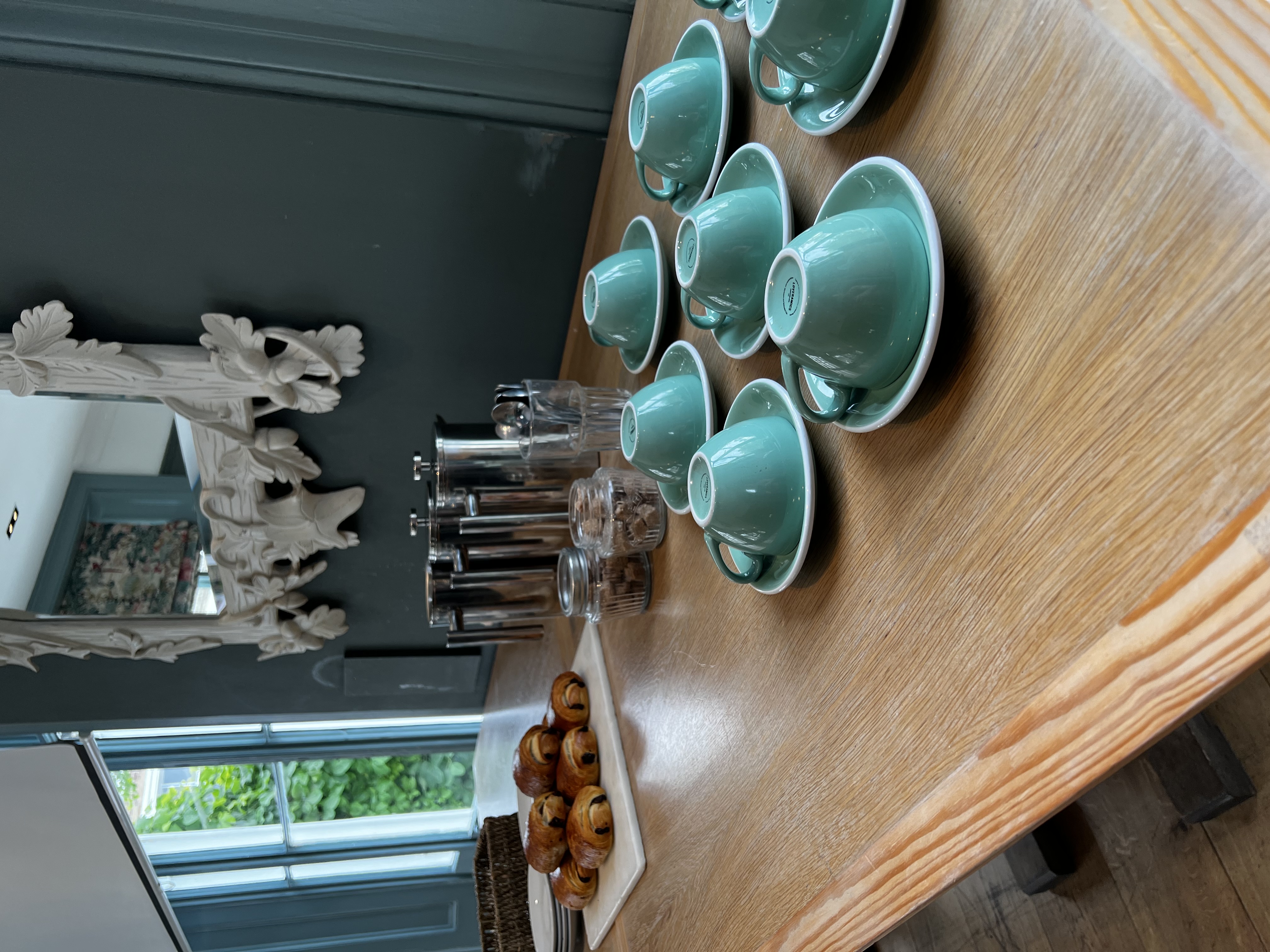 Refreshment station in The Oakley Room, featuring turquoise cups for meetings and events.