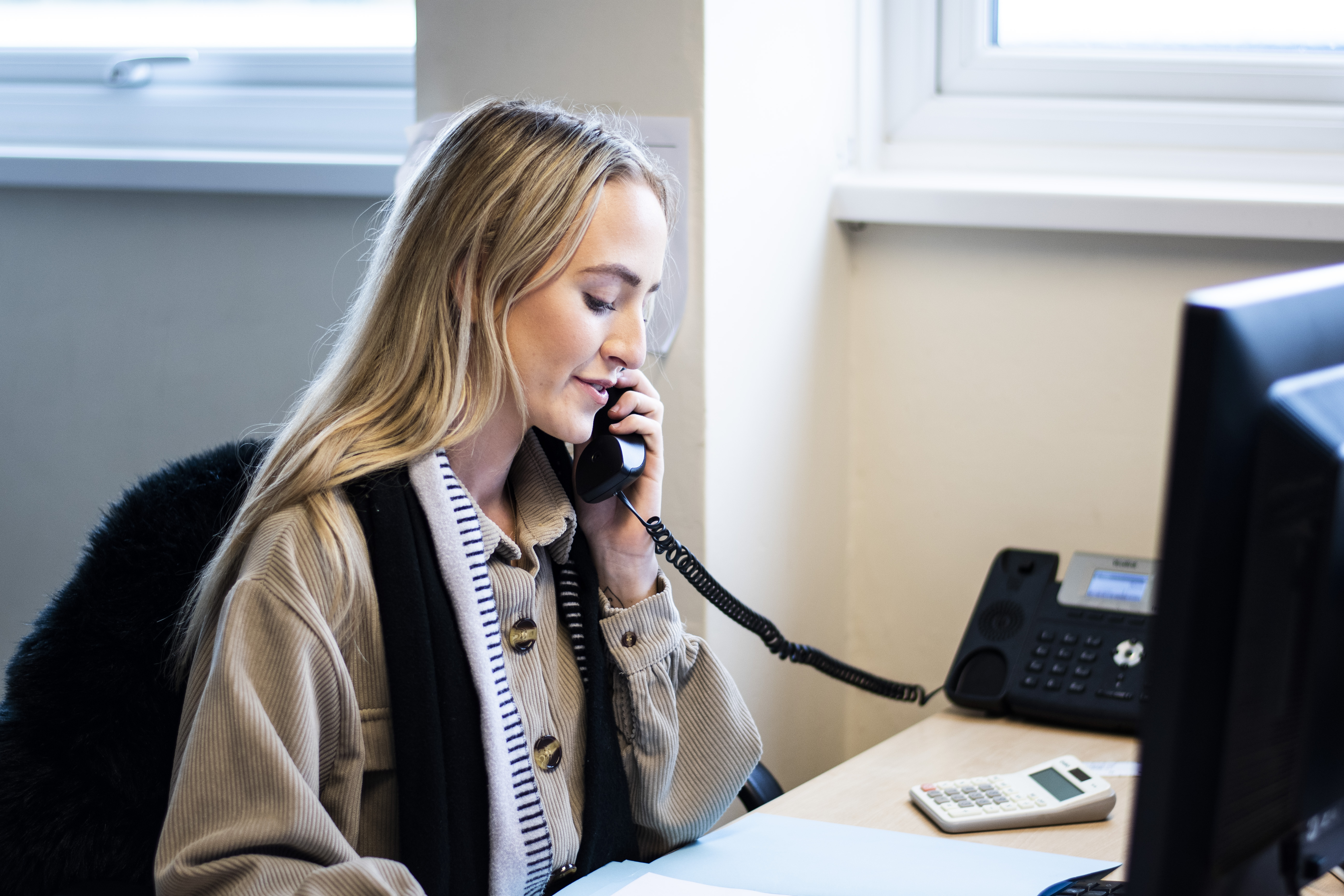 Meeting Room at Liverpool Film Studios with a professional on a call, coordinating events.
