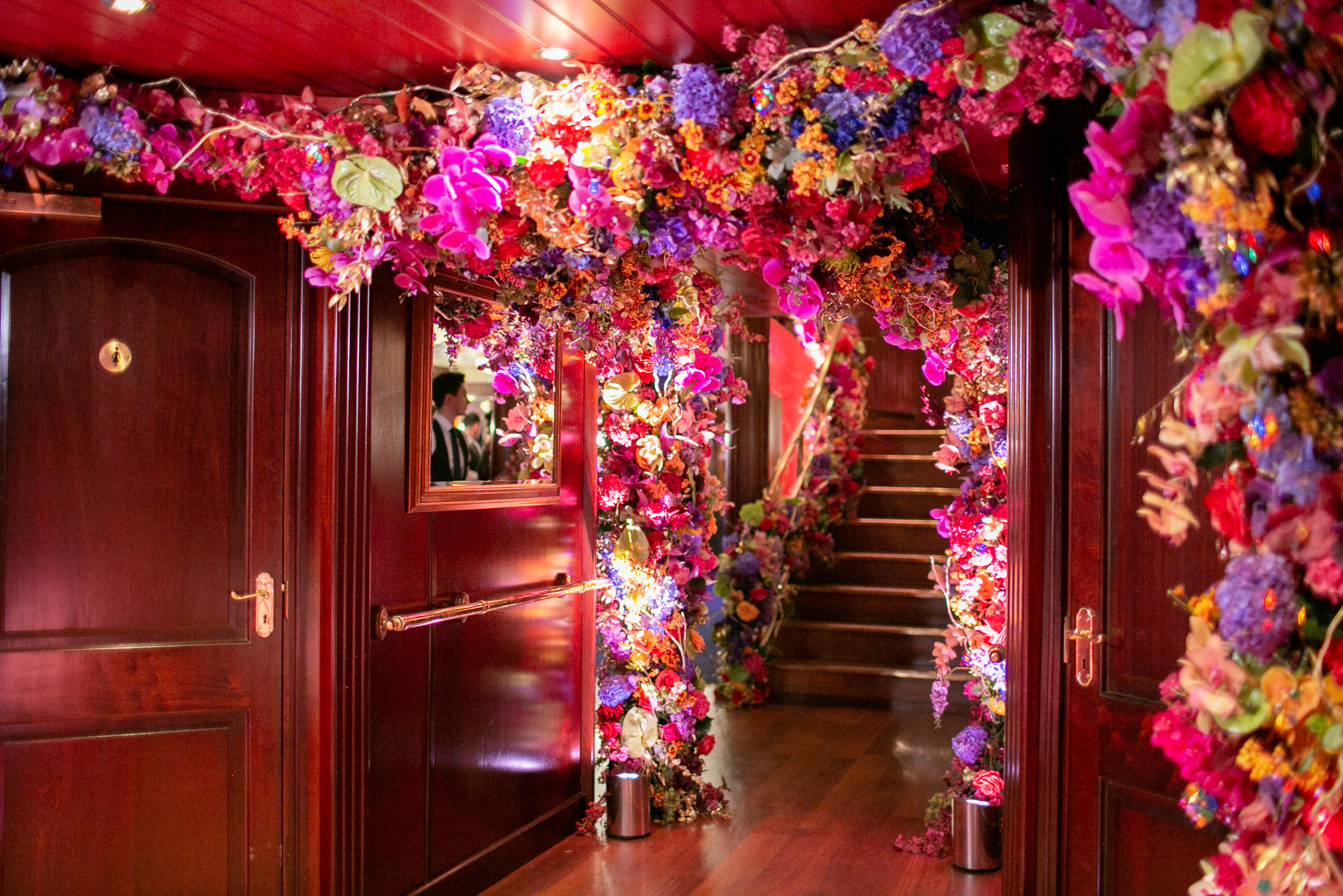 "Elegant corridor with floral decor in Dixie Queen venue, perfect for stunning events."