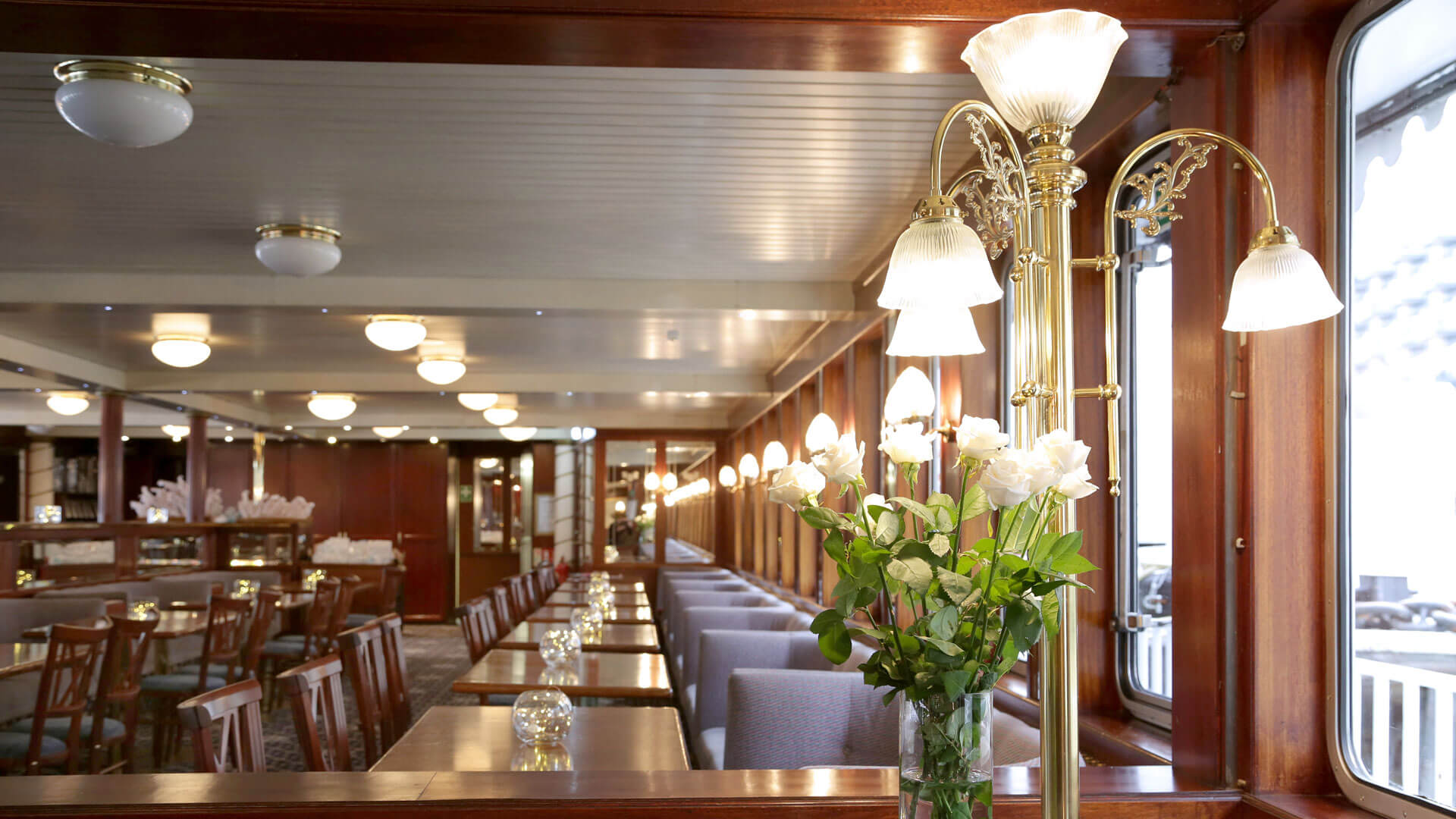 Sophisticated dining space in Dixie Queen with elegant wooden furnishings for upscale events.