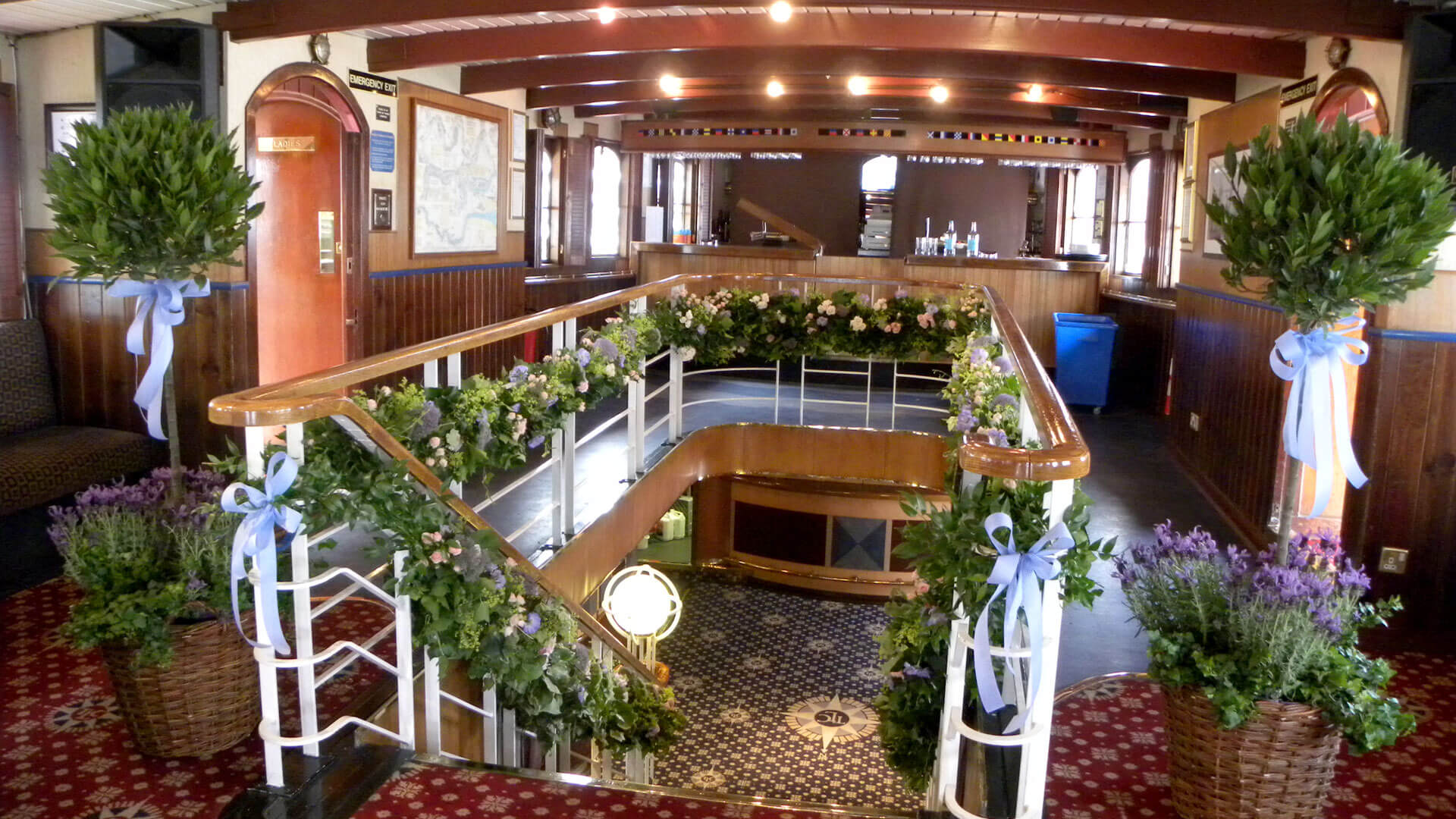 Elegant boat venue with lush greenery, perfect for weddings and corporate events.
