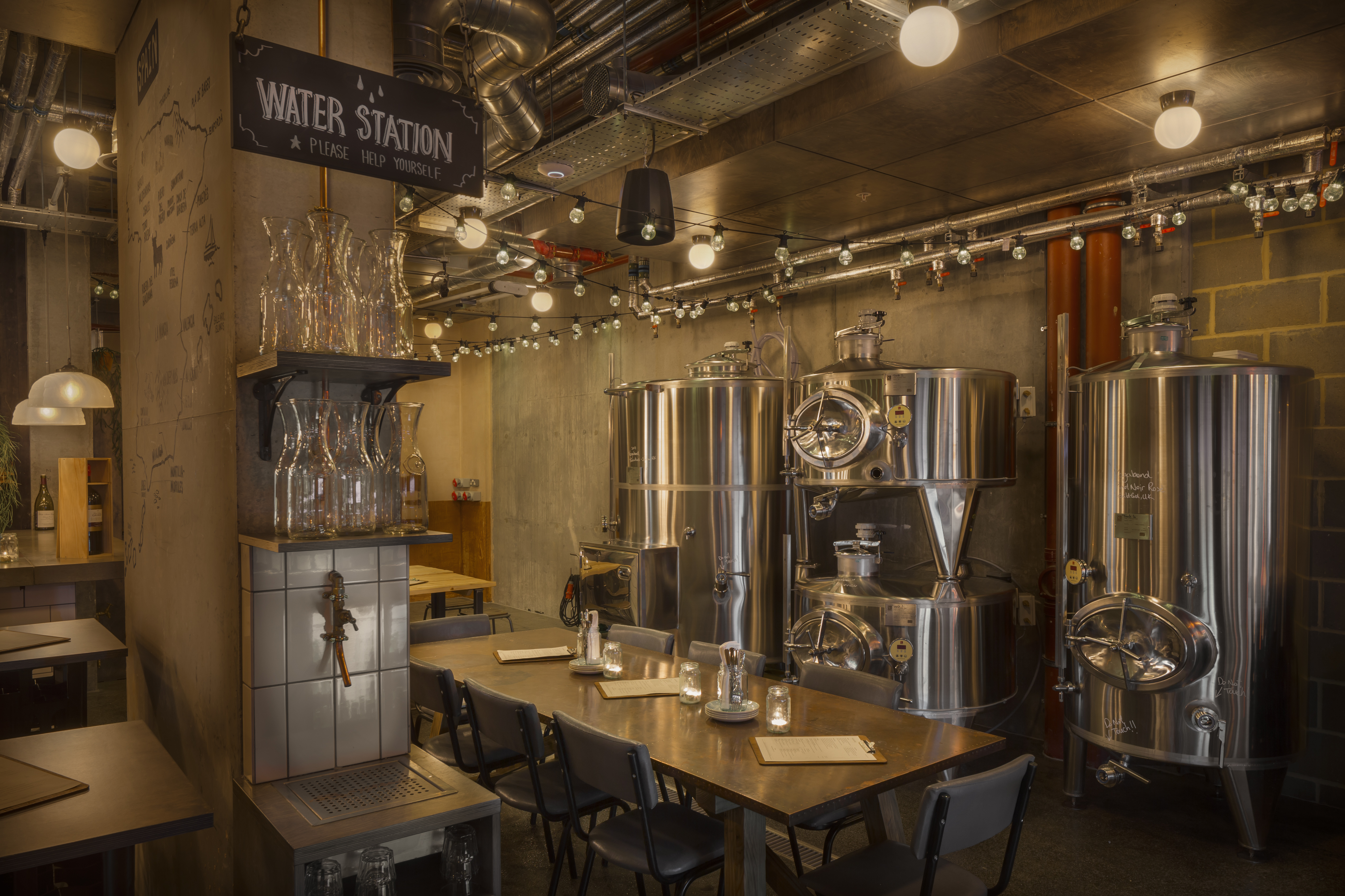 Urban Winery meeting space with long table, ideal for workshops and team events.