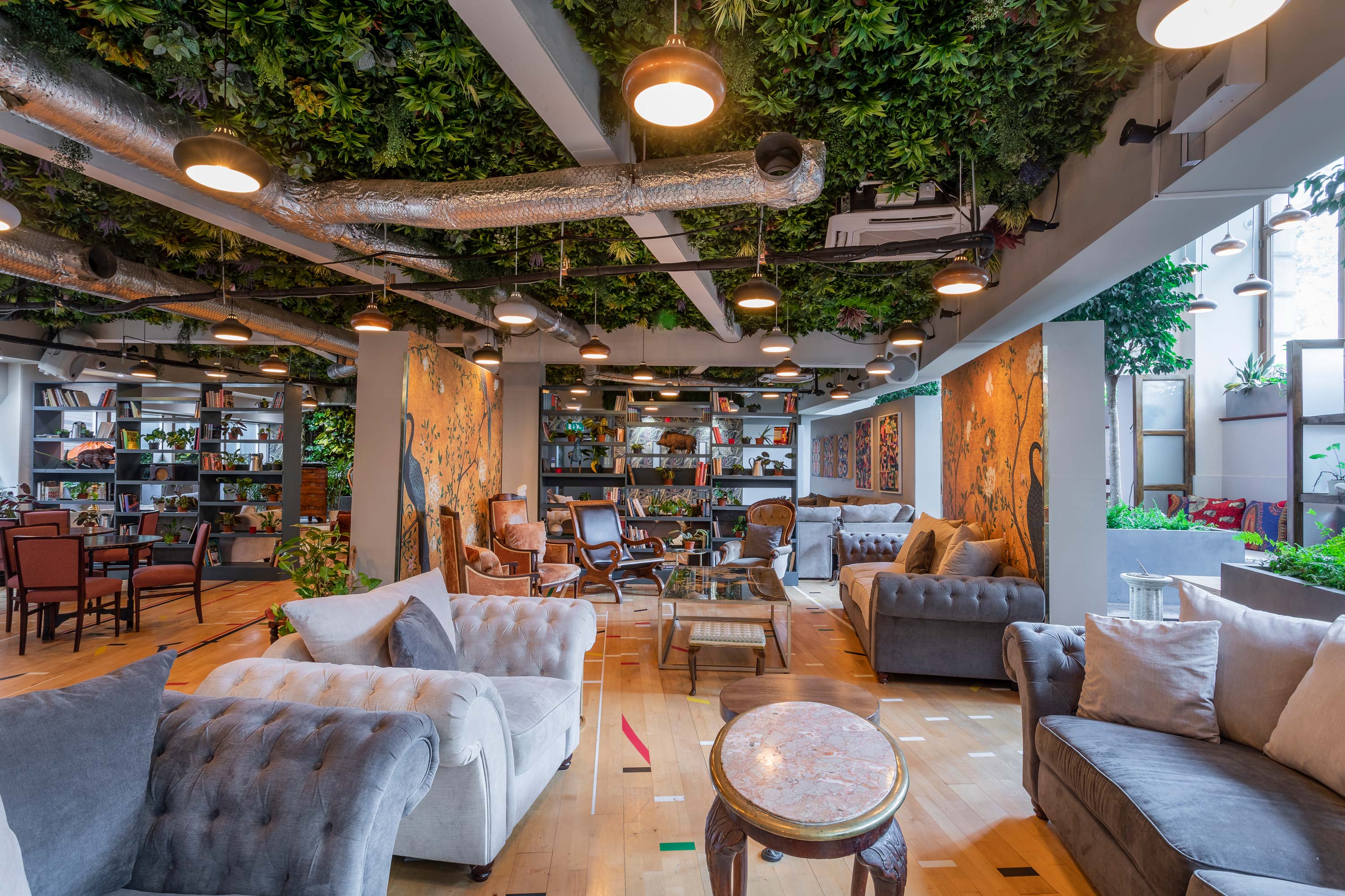 ARBORETUM Main Lounge: Cozy event space with greenery for networking and gatherings.