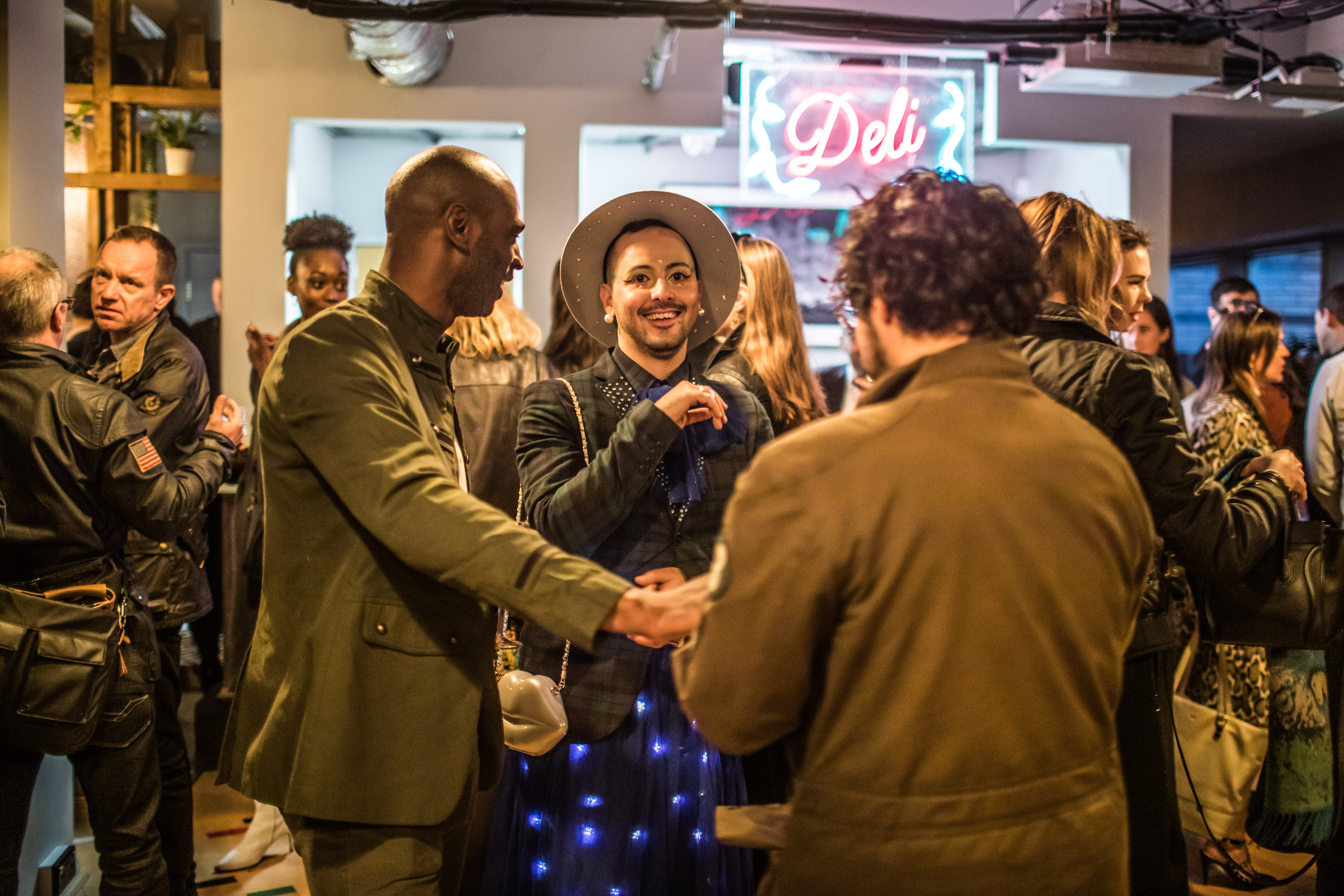 Vibrant networking event in ARBORETUM with attendees in smart-casual attire.