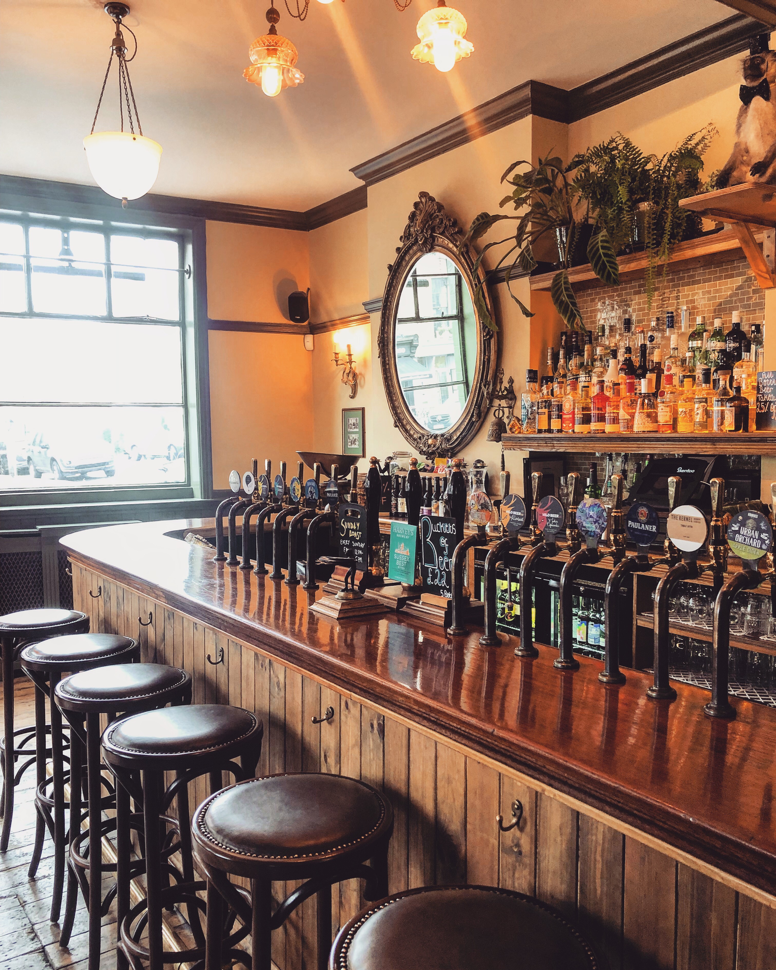 Bar Room at The George and Monkey with polished wooden counter, ideal for networking events.