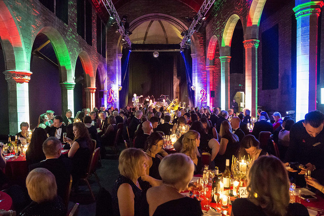 Vibrant gala at Roxy Central with elegantly dressed attendees and live music ambiance.