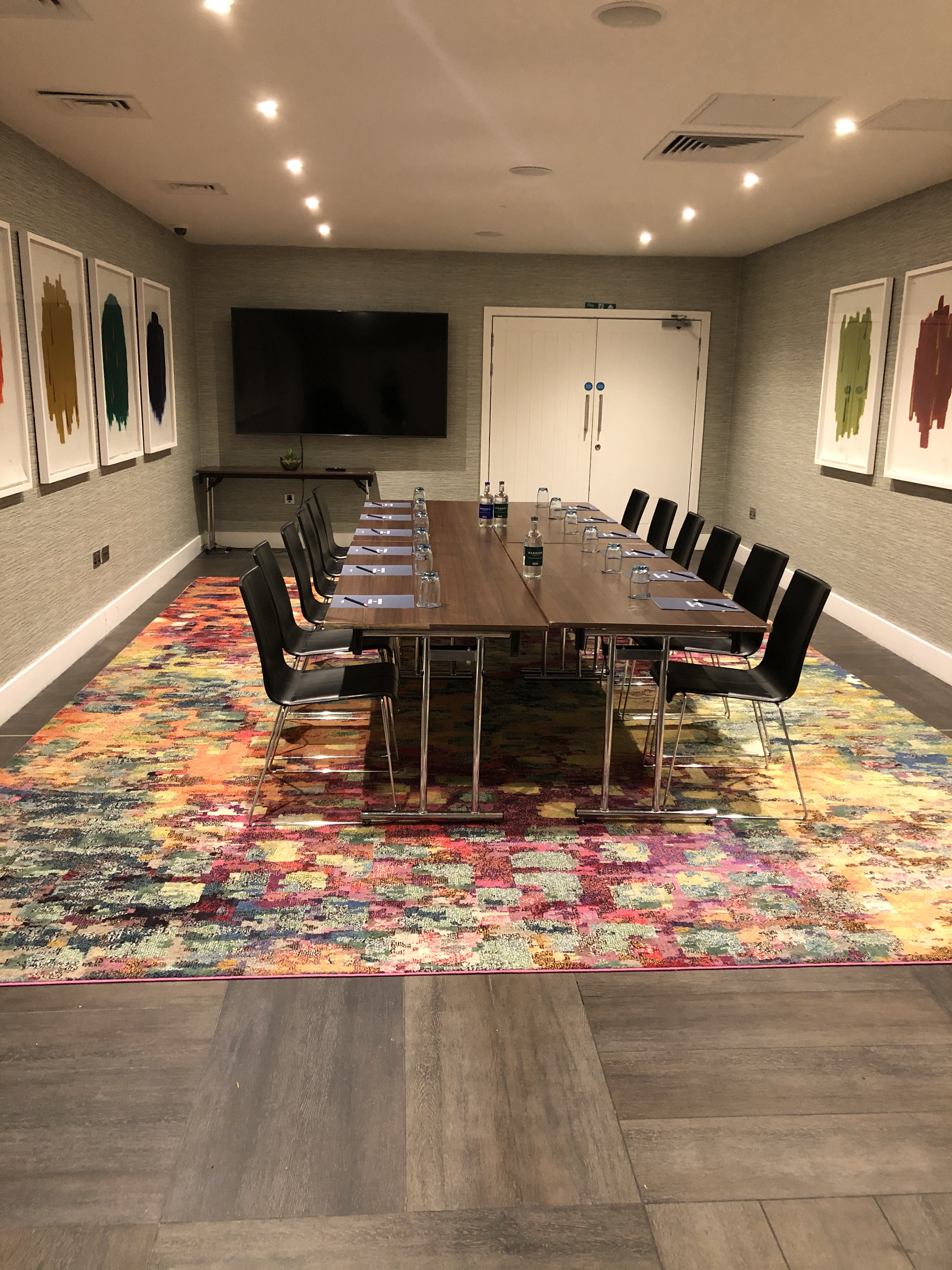 Harbour Suite 3 meeting room with wooden table, ideal for corporate events and presentations.