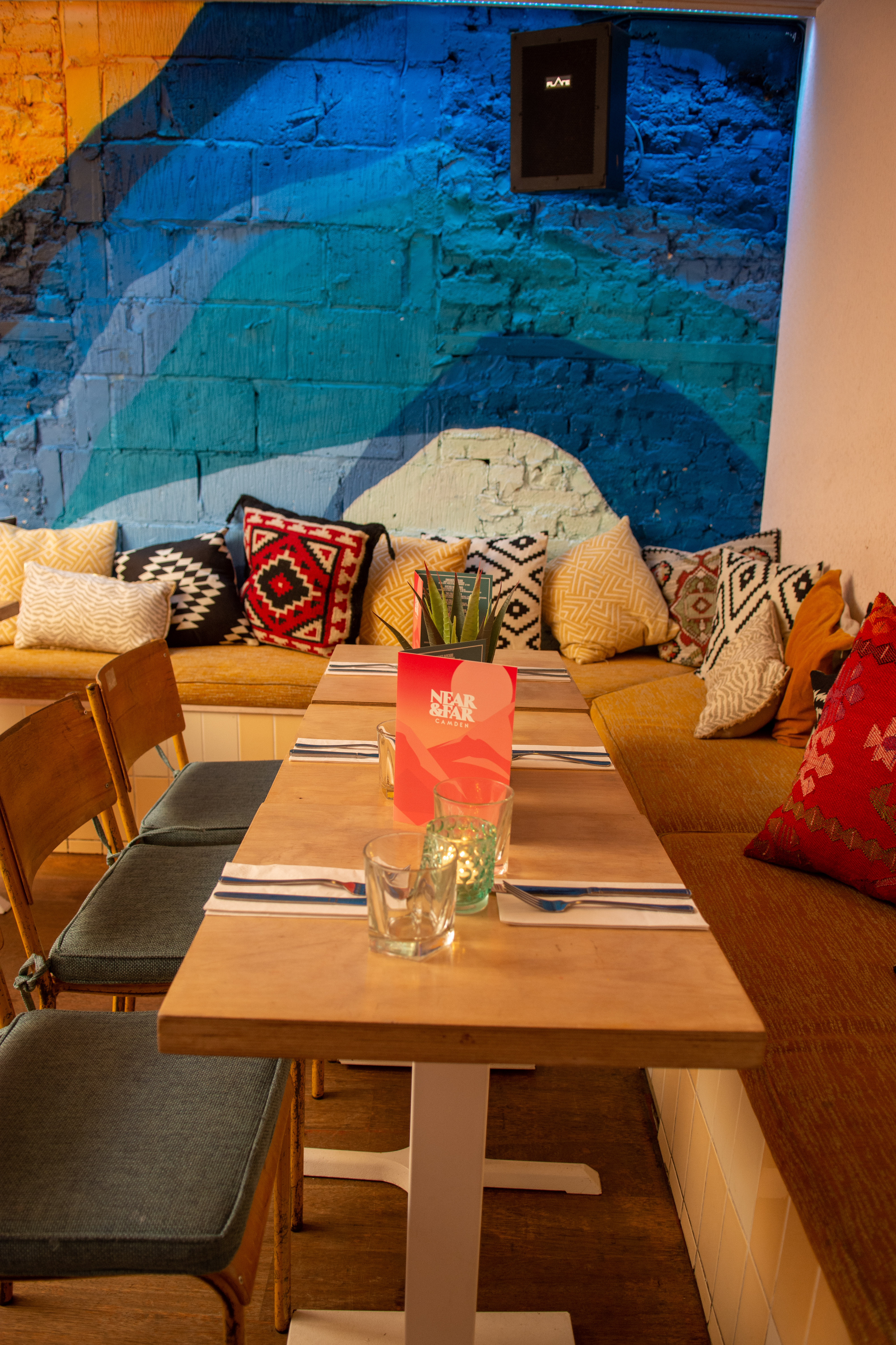 Vibrant seating area with colorful cushions for casual meetings and small events in Studio 48.