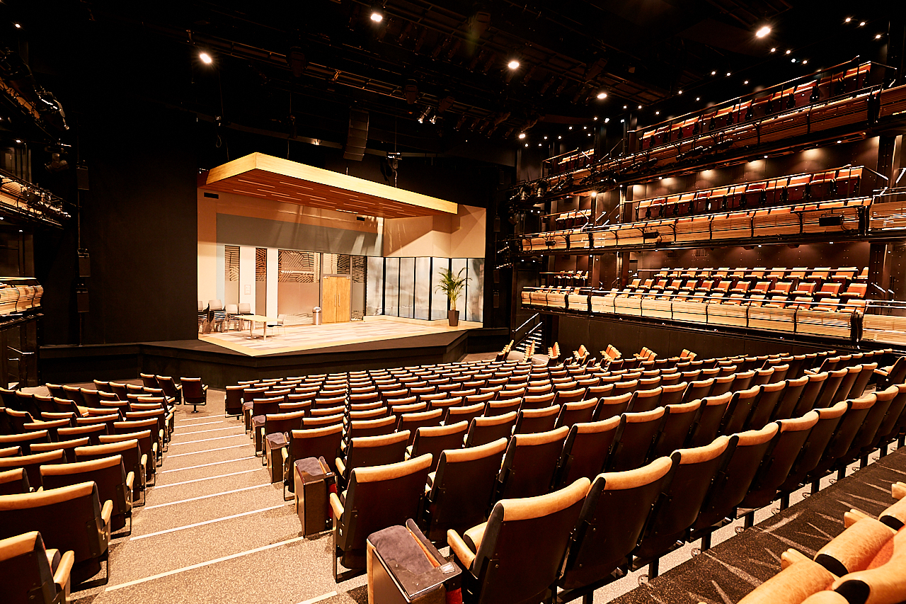 Bridge Theatre auditorium with tiered seating, ideal for conferences and performances.