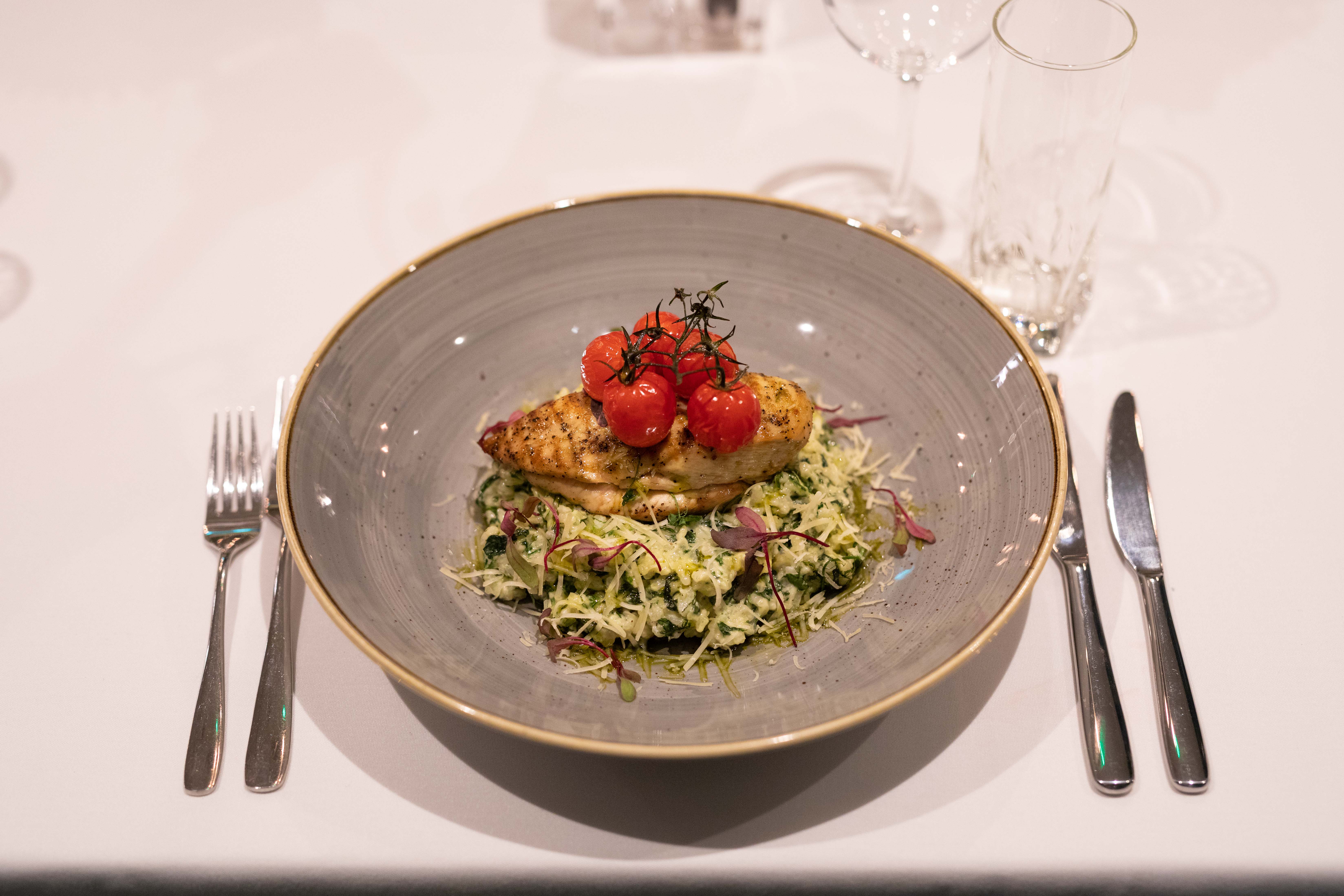 Grilled chicken with herbed rice at Whitechapel Think Factory, upscale dining event.