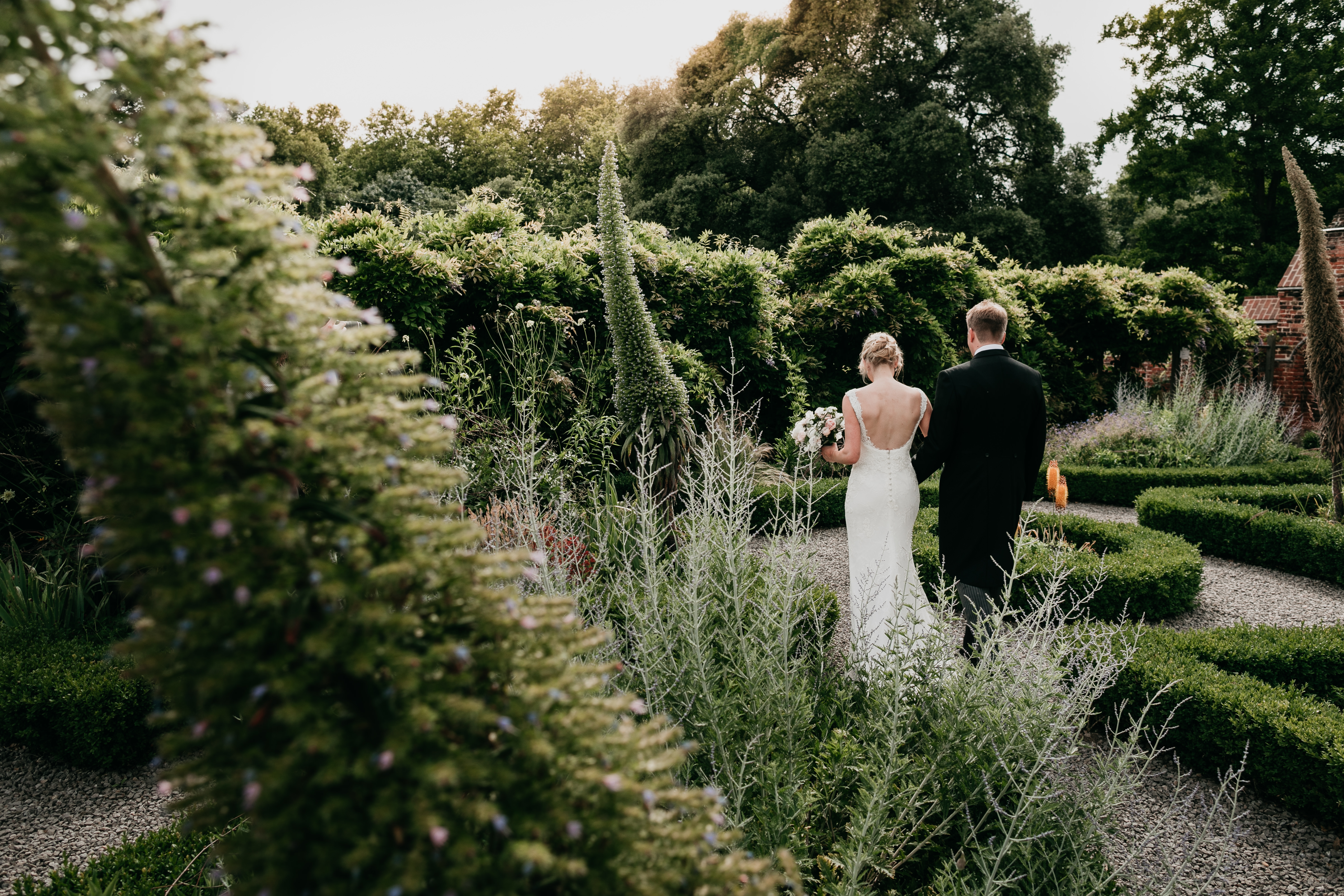 Couple walking in Walled Garden, Fulham Palace, ideal for weddings and outdoor events.