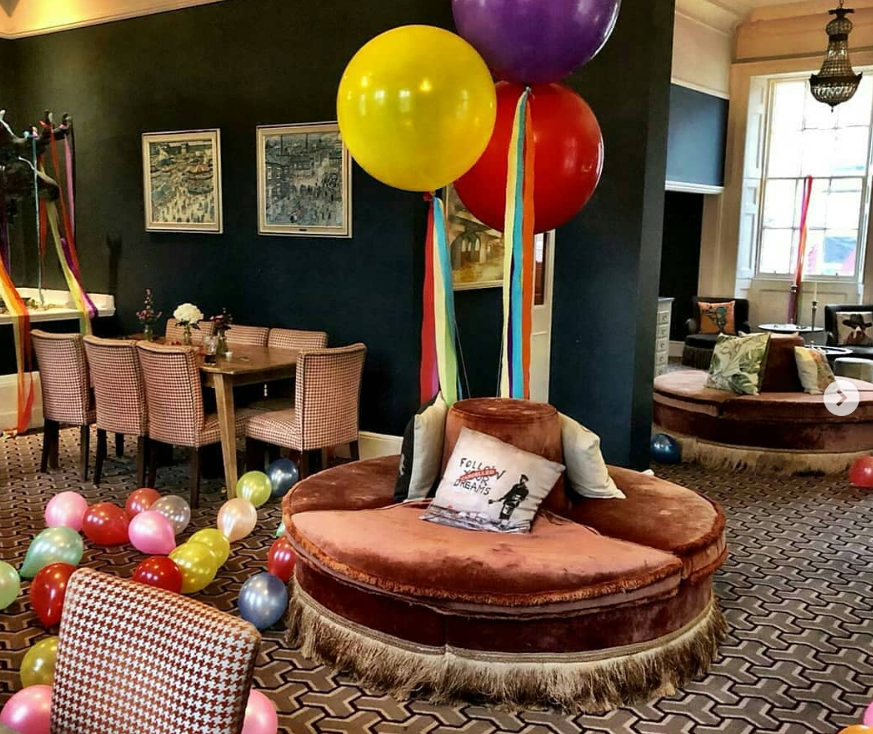 Colorful Lillie Lounge for festive gatherings with plush seating and decorations.
