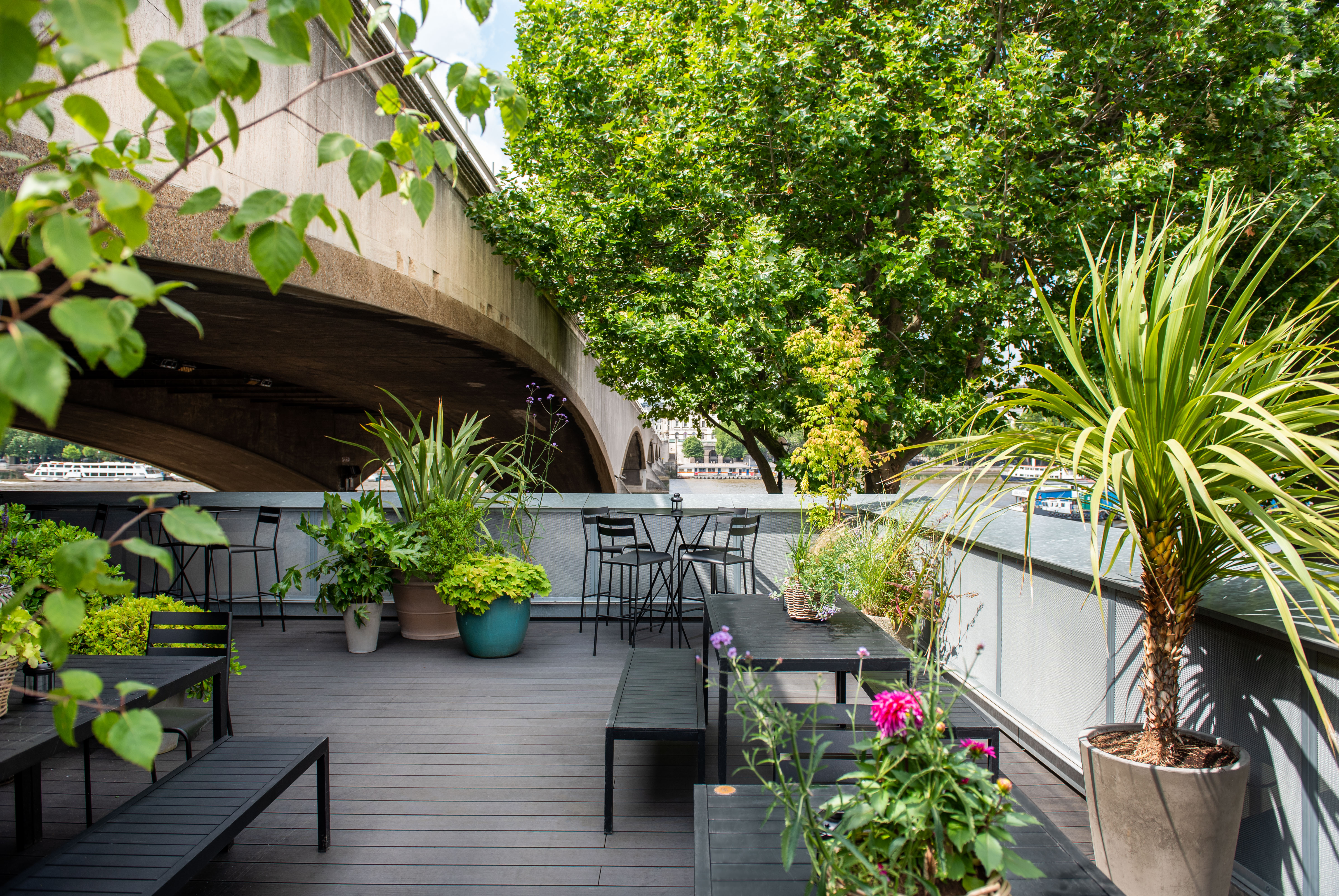 Stylish outdoor terrace at Balcony Bar, perfect for networking events by the river.