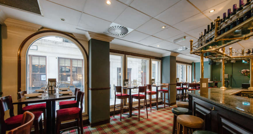 Stylish restaurant venue with natural light for intimate meetings and networking events.