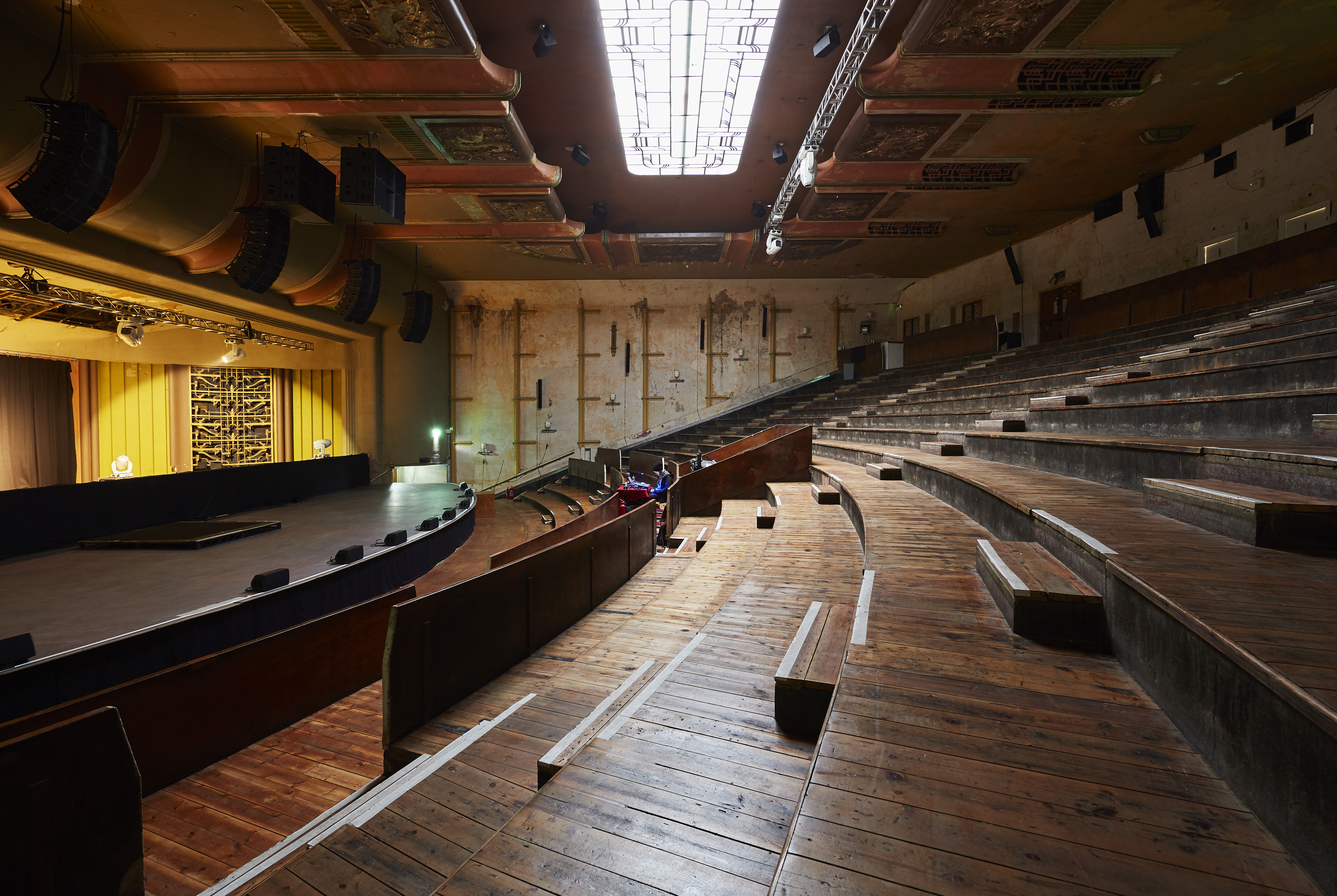 Spacious auditorium with tiered seating for conferences and presentations at EartH Theatre.