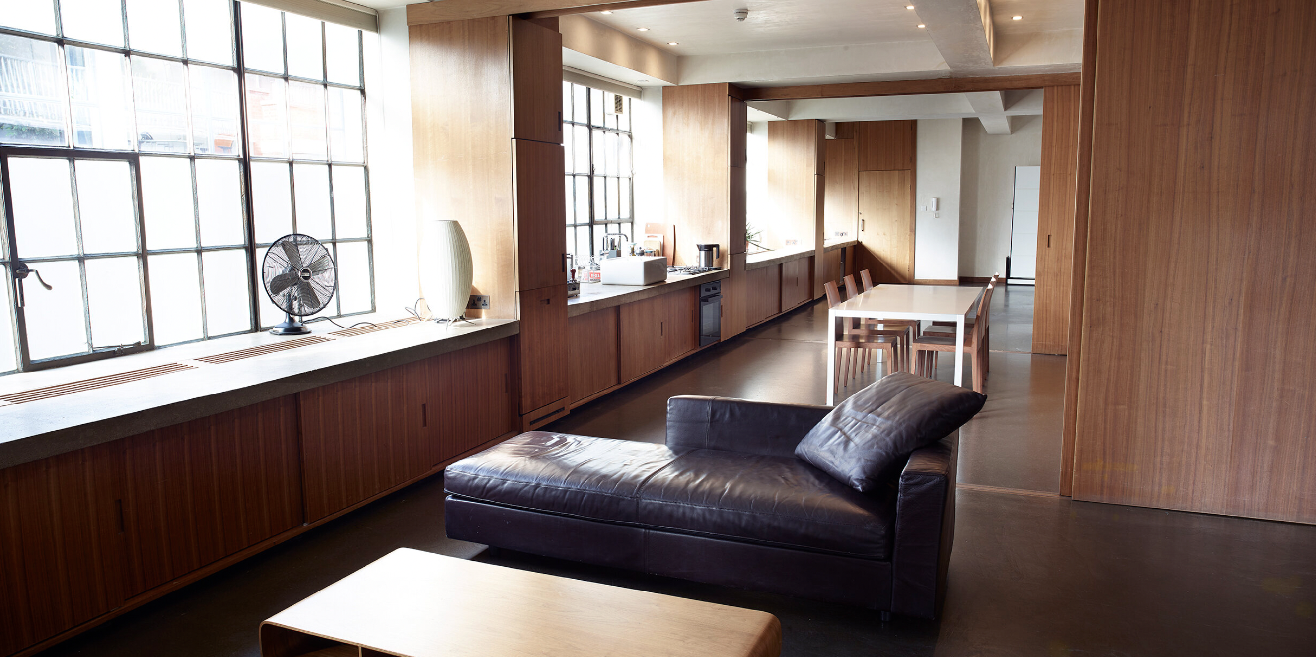 Modern meeting space with large windows at Robert's Place Studios for events and seminars.