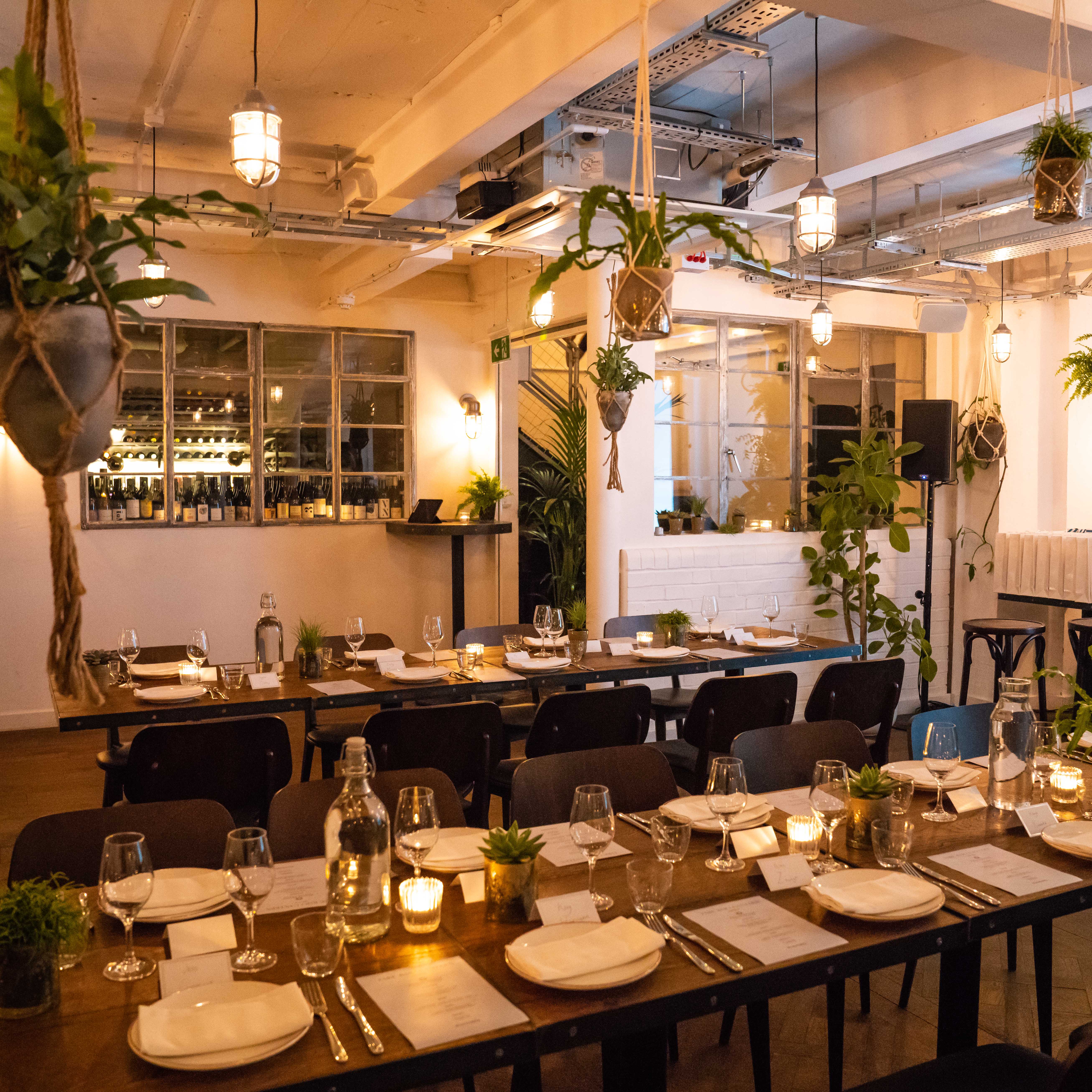 Intimate wine room at FARE Restaurant, elegant table setup for dinner events.