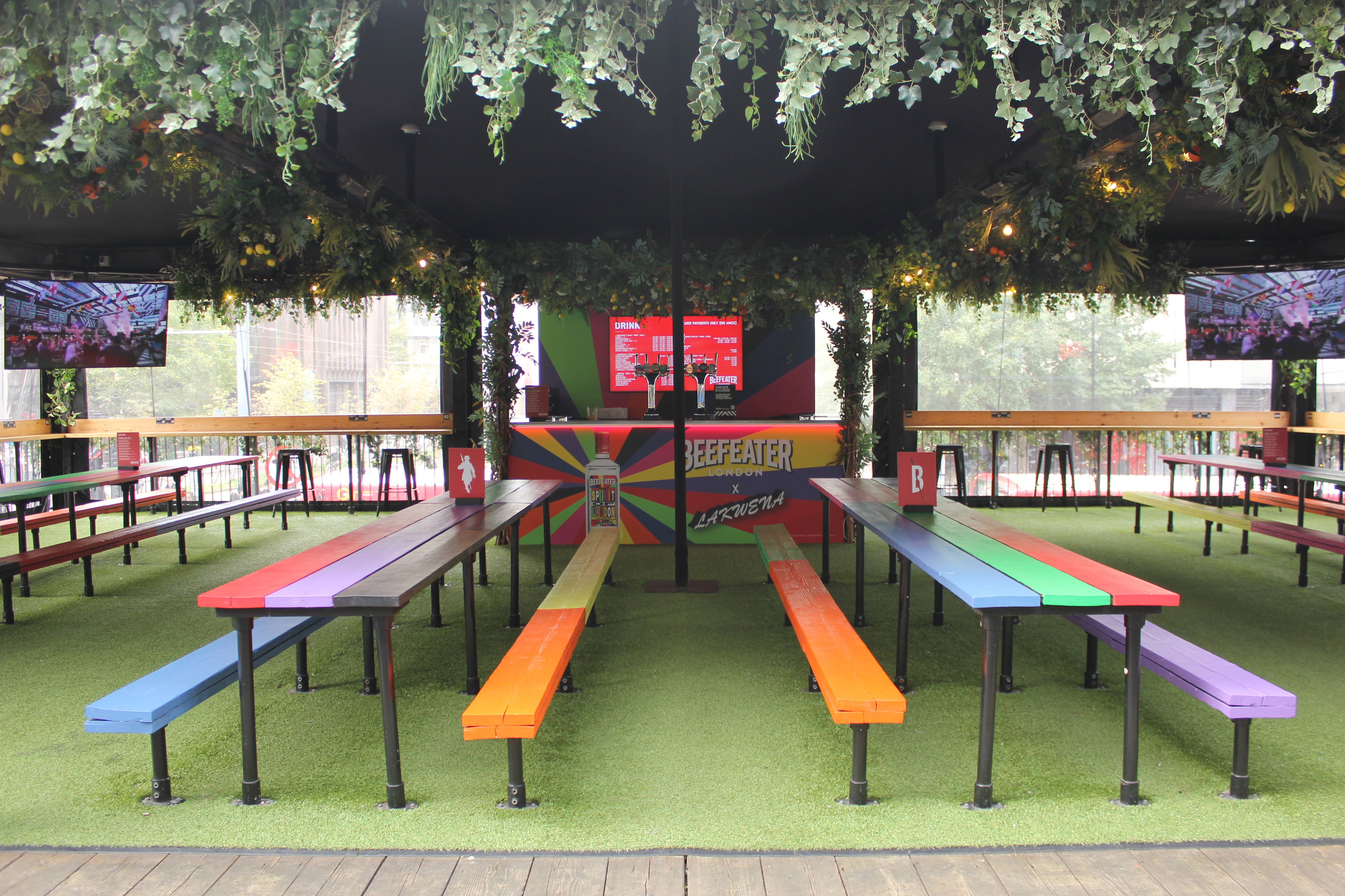 Vibrant outdoor event space with colorful benches at Boxpark Croydon for gatherings.