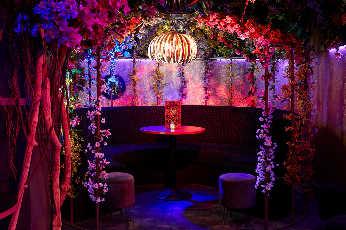 Vibrant Le Jardin event space in Le Fez with floral decor, ideal for cocktail parties.