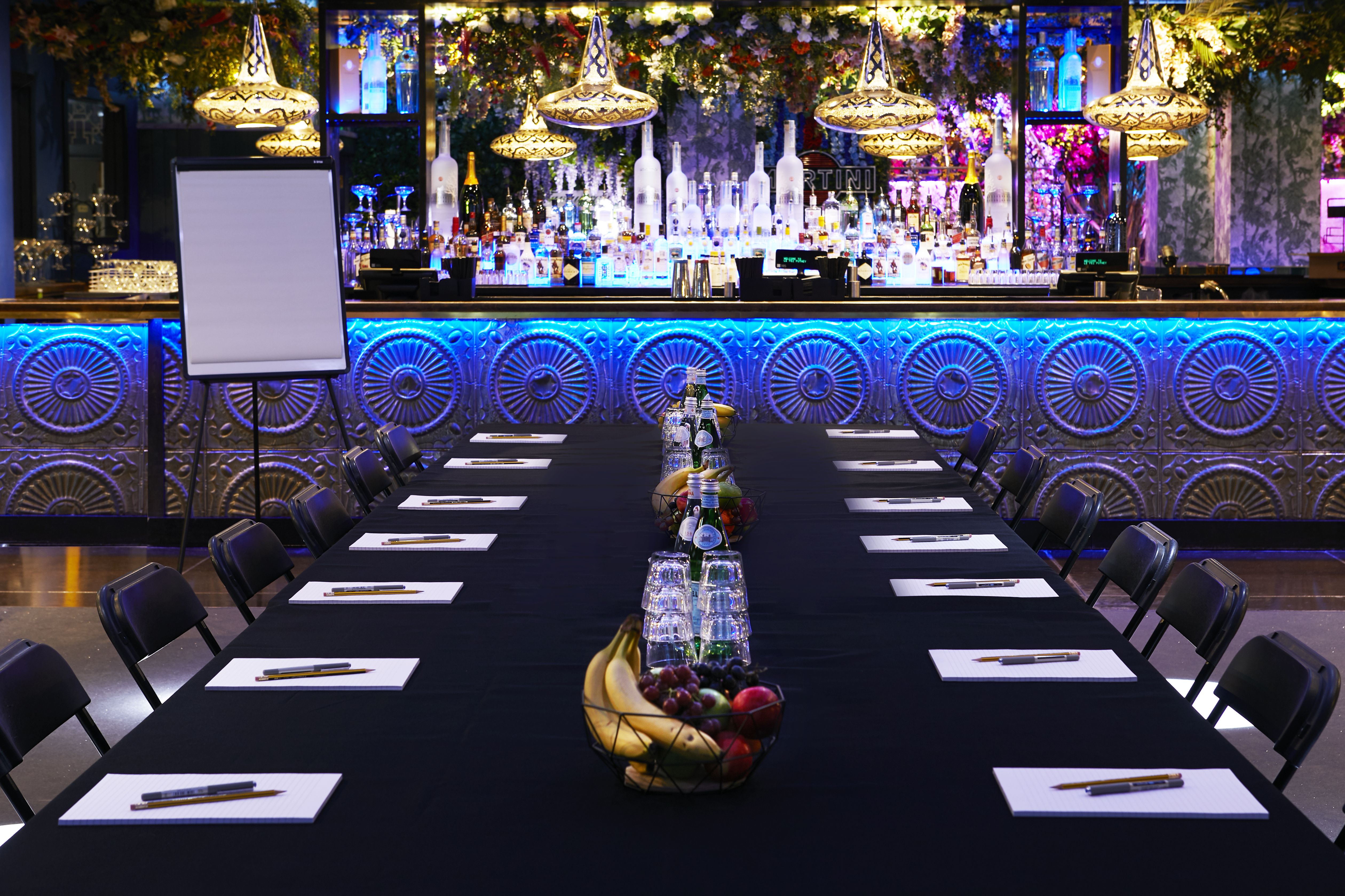 Elegant meeting space at Le Club, featuring a long table and stylish decor for corporate events.