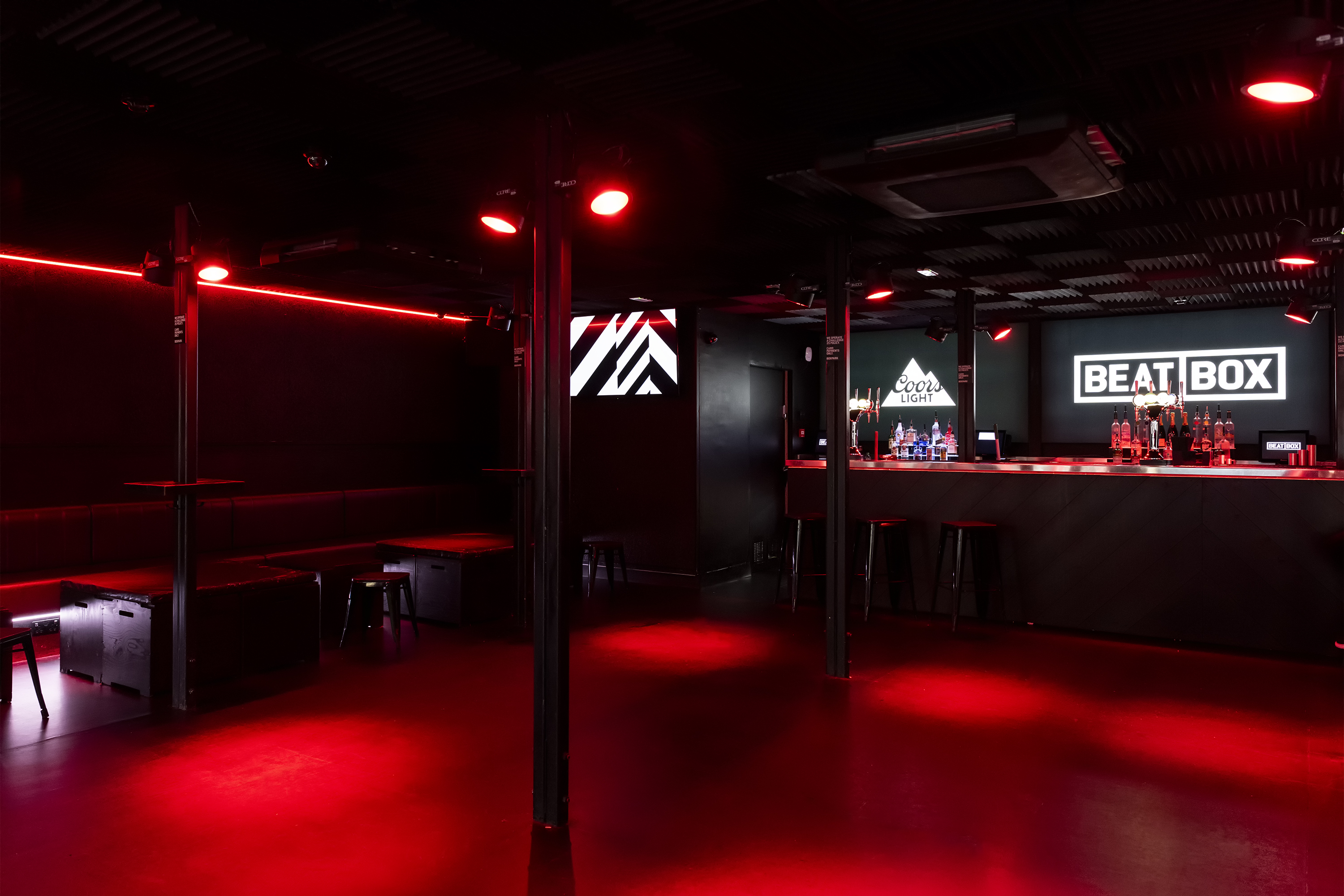 BeatBox at Boxpark Croydon: modern event space with red lighting for nightlife and meetings.
