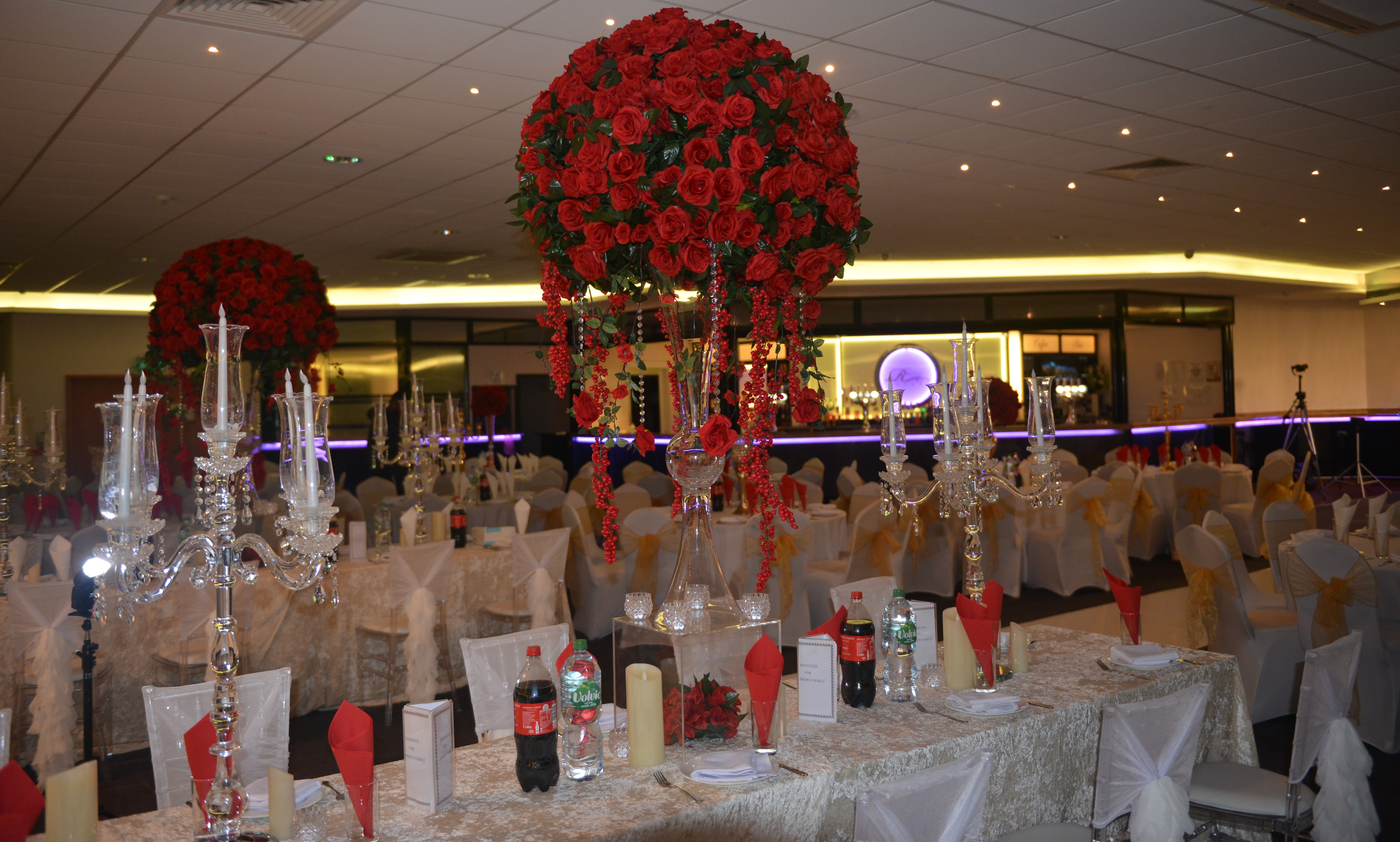 Elegant Main Hall with red rose centerpieces for luxury events and celebrations.