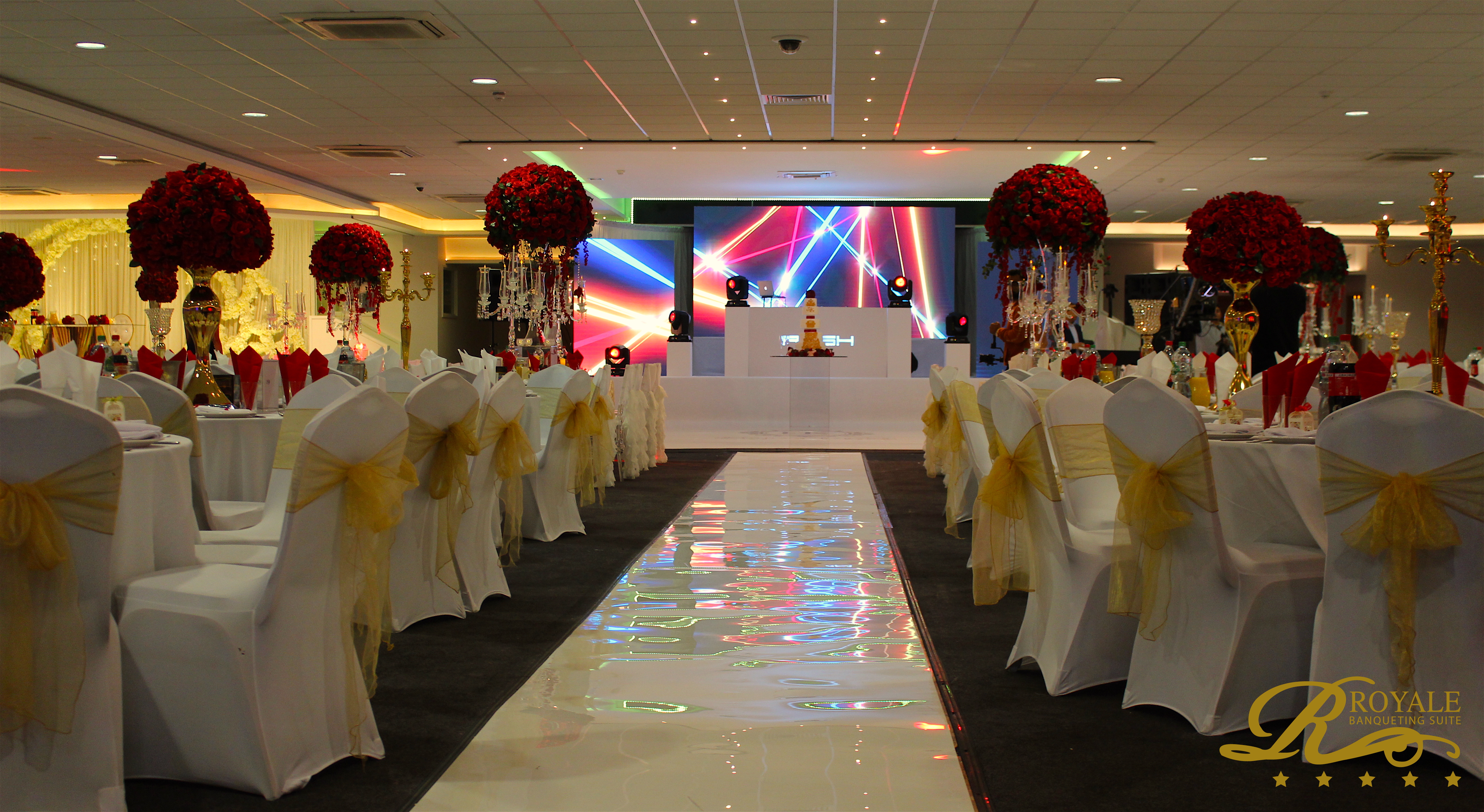 Main hall in Royale Banqueting Suite with elegant tables, ideal for corporate events and celebrations.