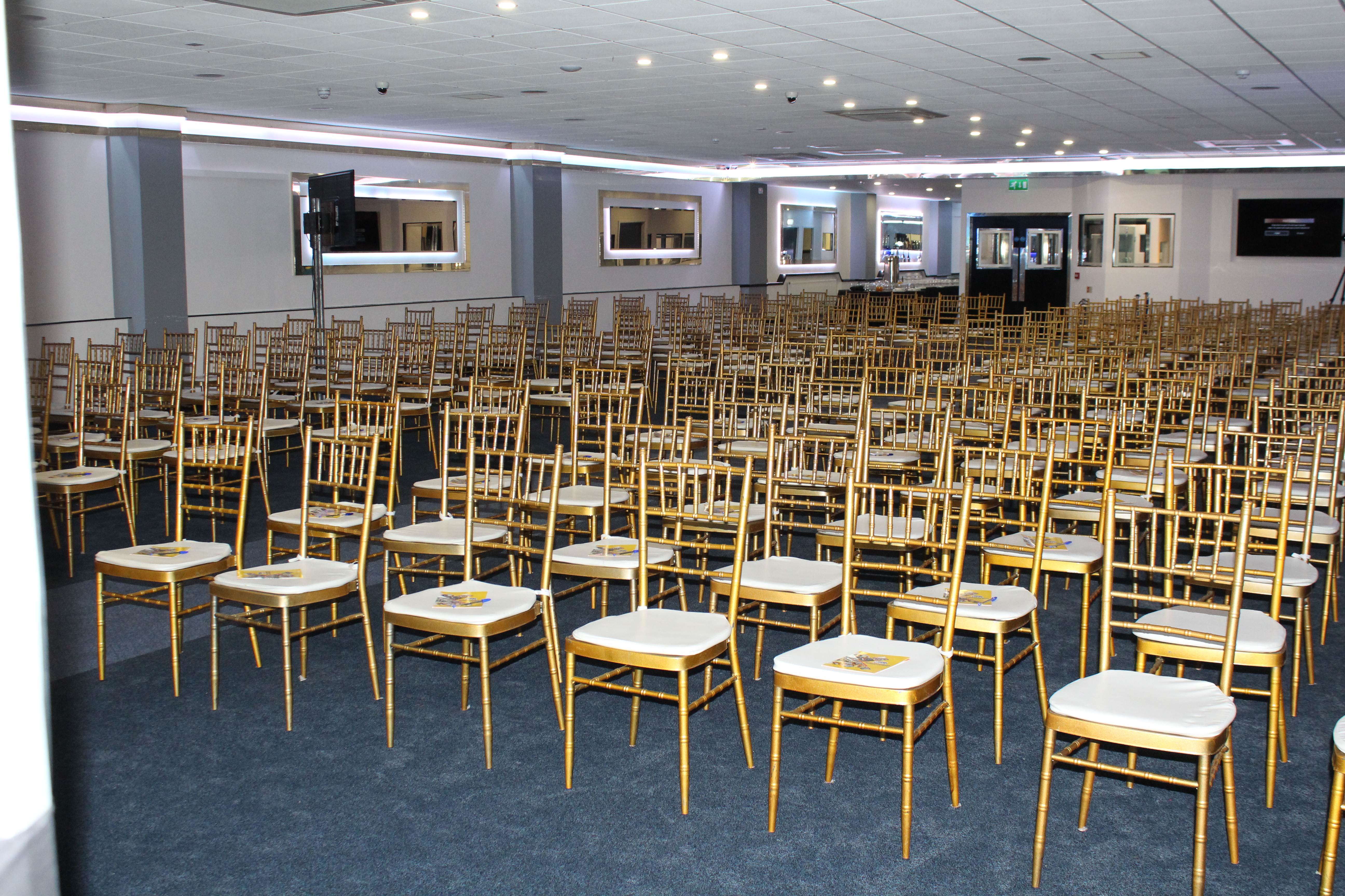 Golden Suite at Royale Banqueting, spacious venue with gold chiavari chairs for events.