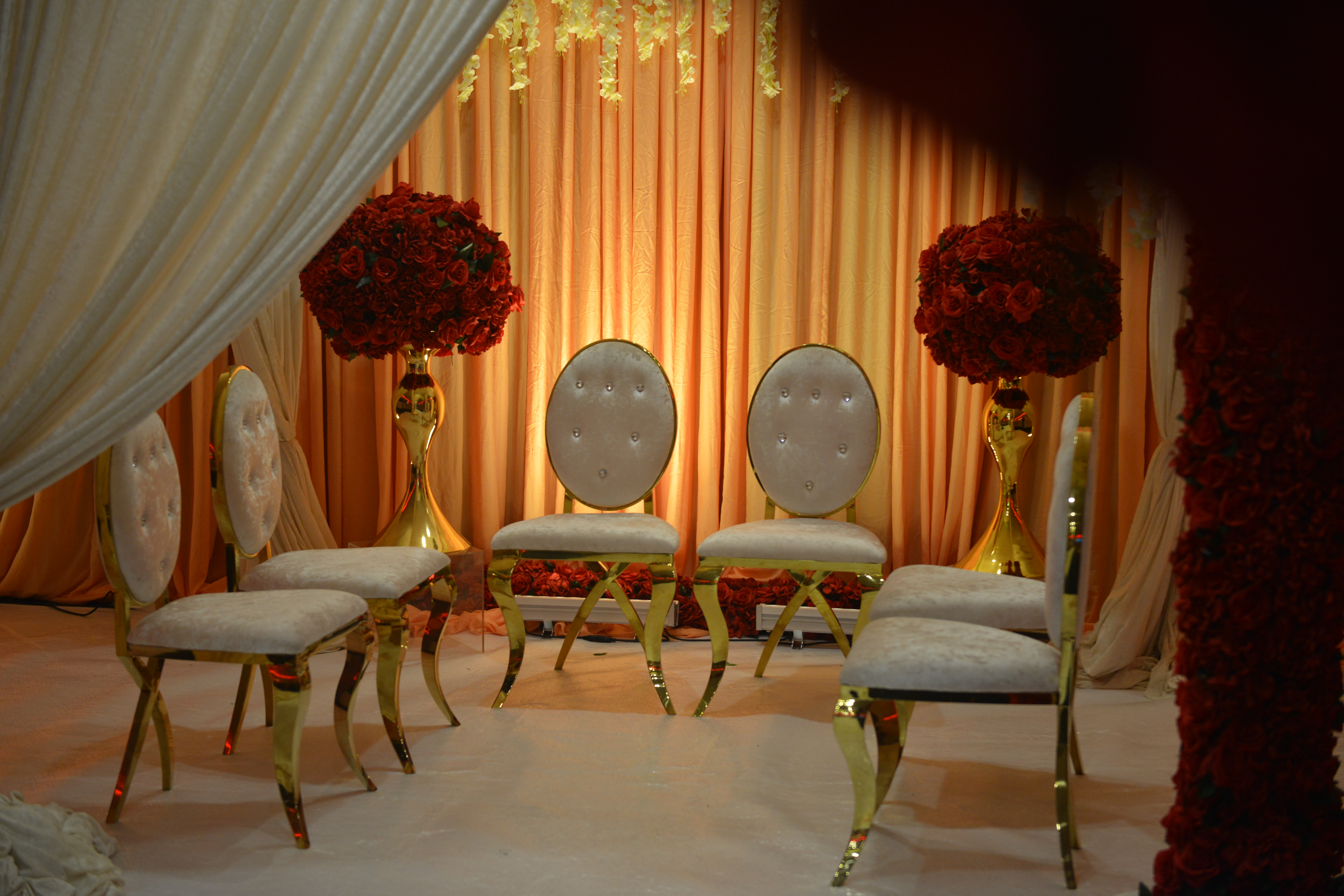 Elegant Golden Suite with plush chairs, perfect for intimate gatherings and ceremonies.