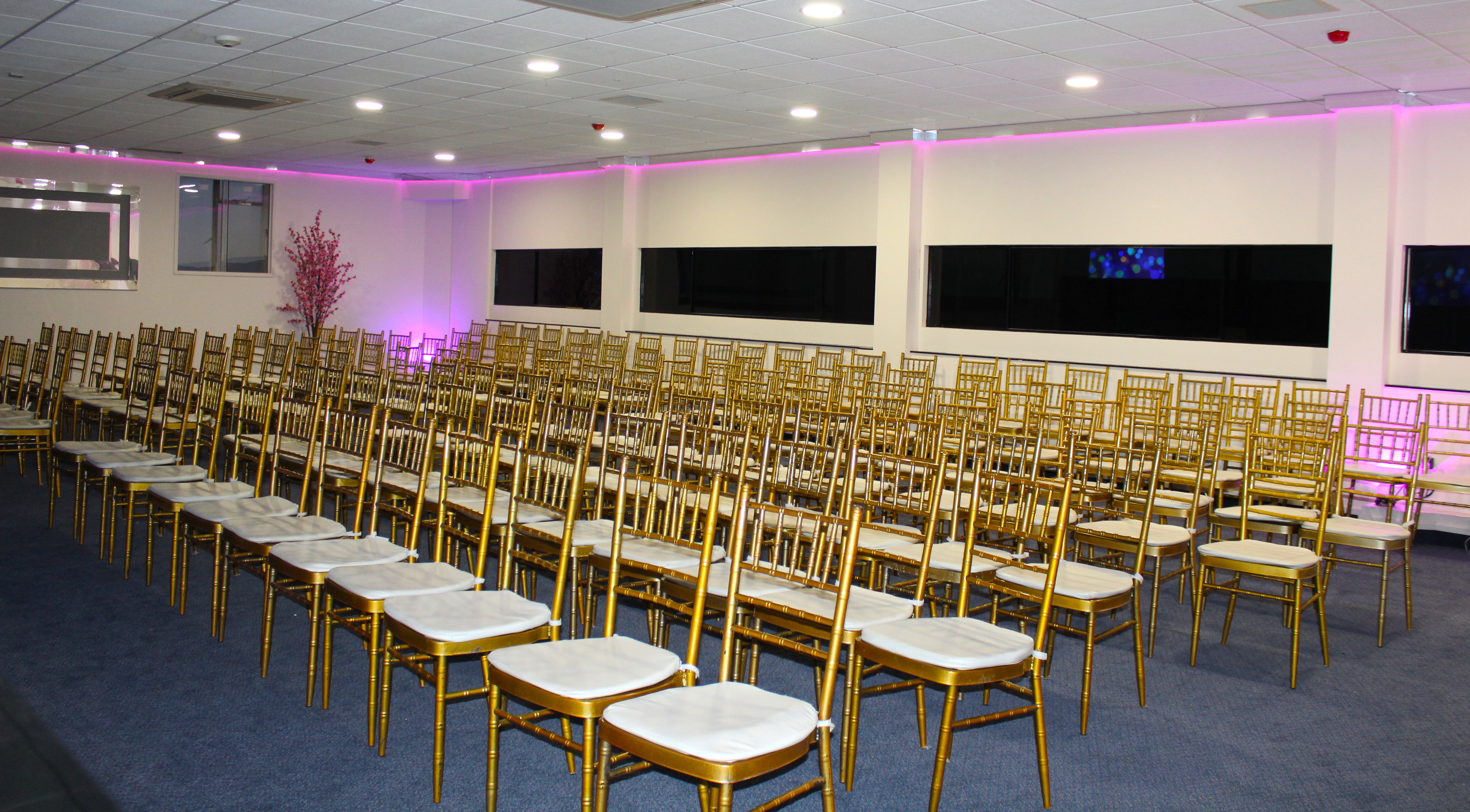 Elegant Silver Suite with gold chairs, ideal for conferences and weddings.