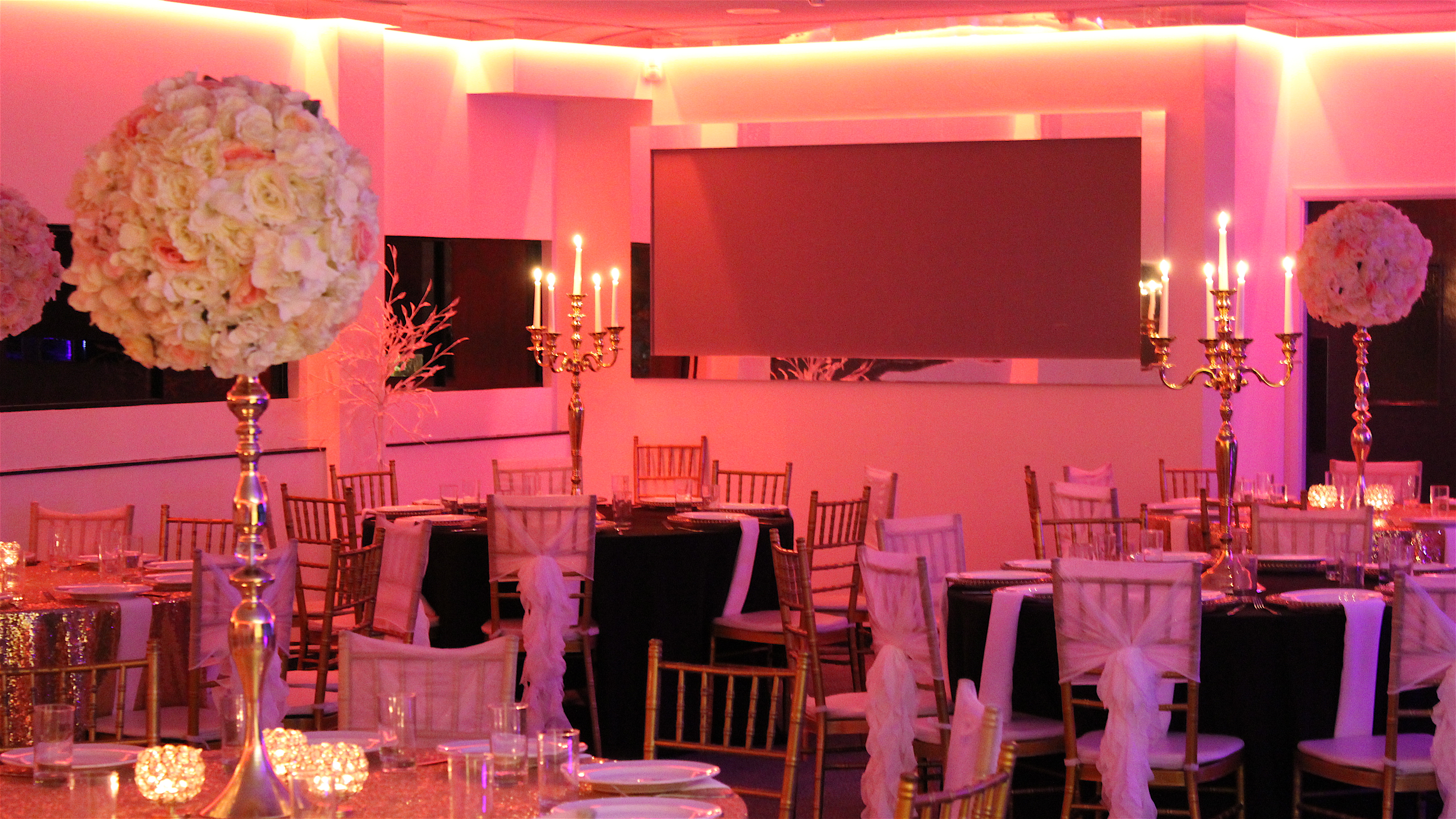 Elegant Silver Suite with floral centerpieces, perfect for weddings and corporate events.