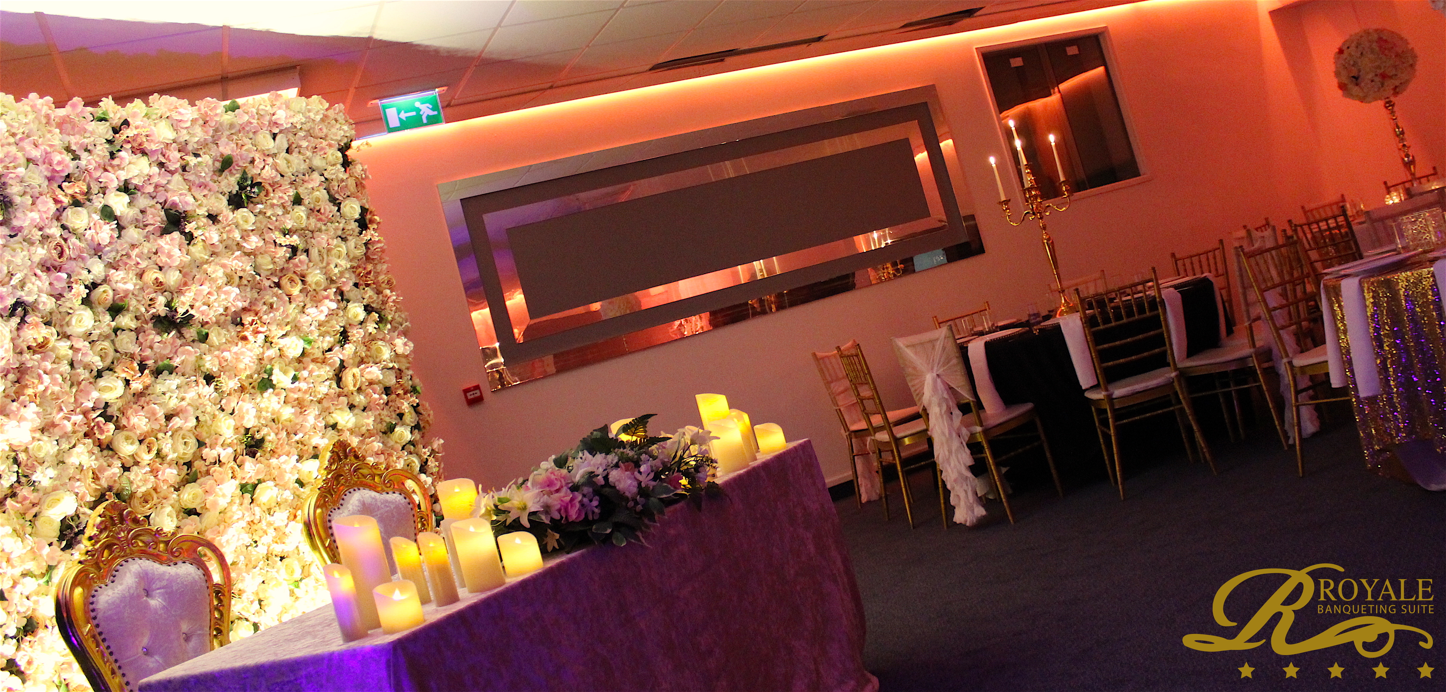 Elegant Silver Suite with floral backdrop, perfect for weddings and corporate events.