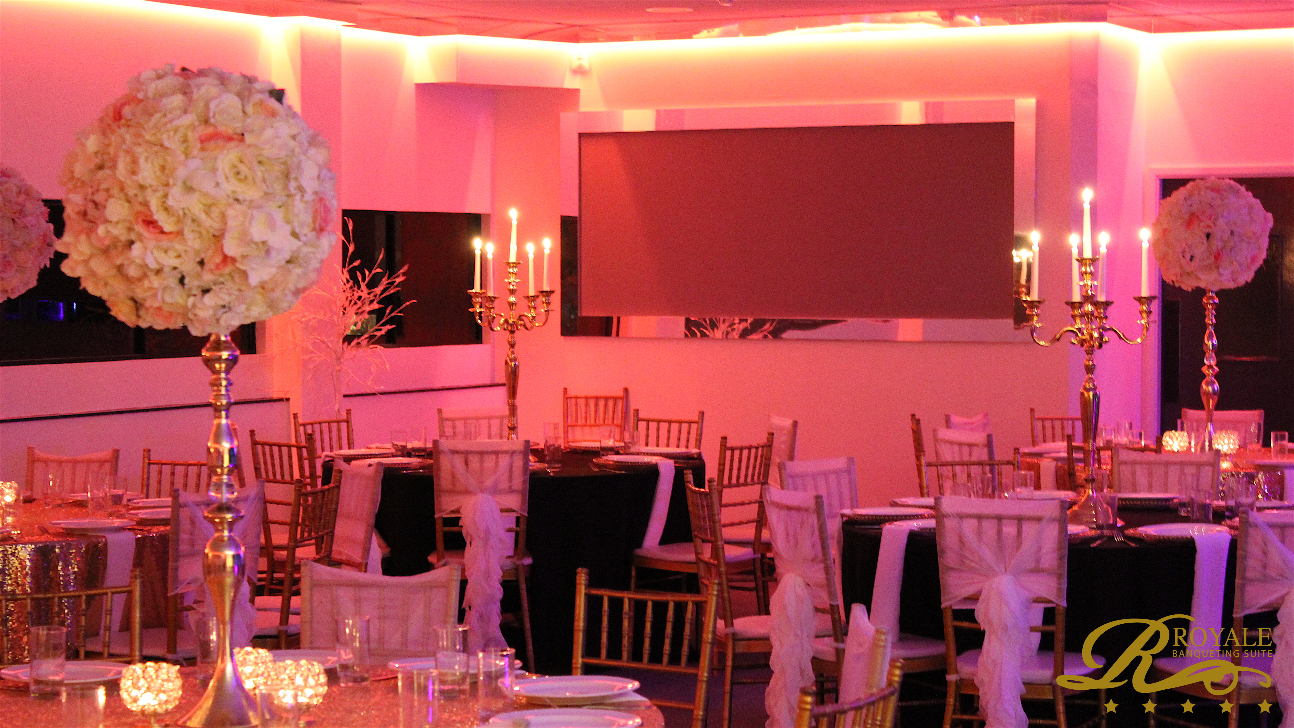 Elegant Silver Suite with floral centerpieces for upscale weddings and events.